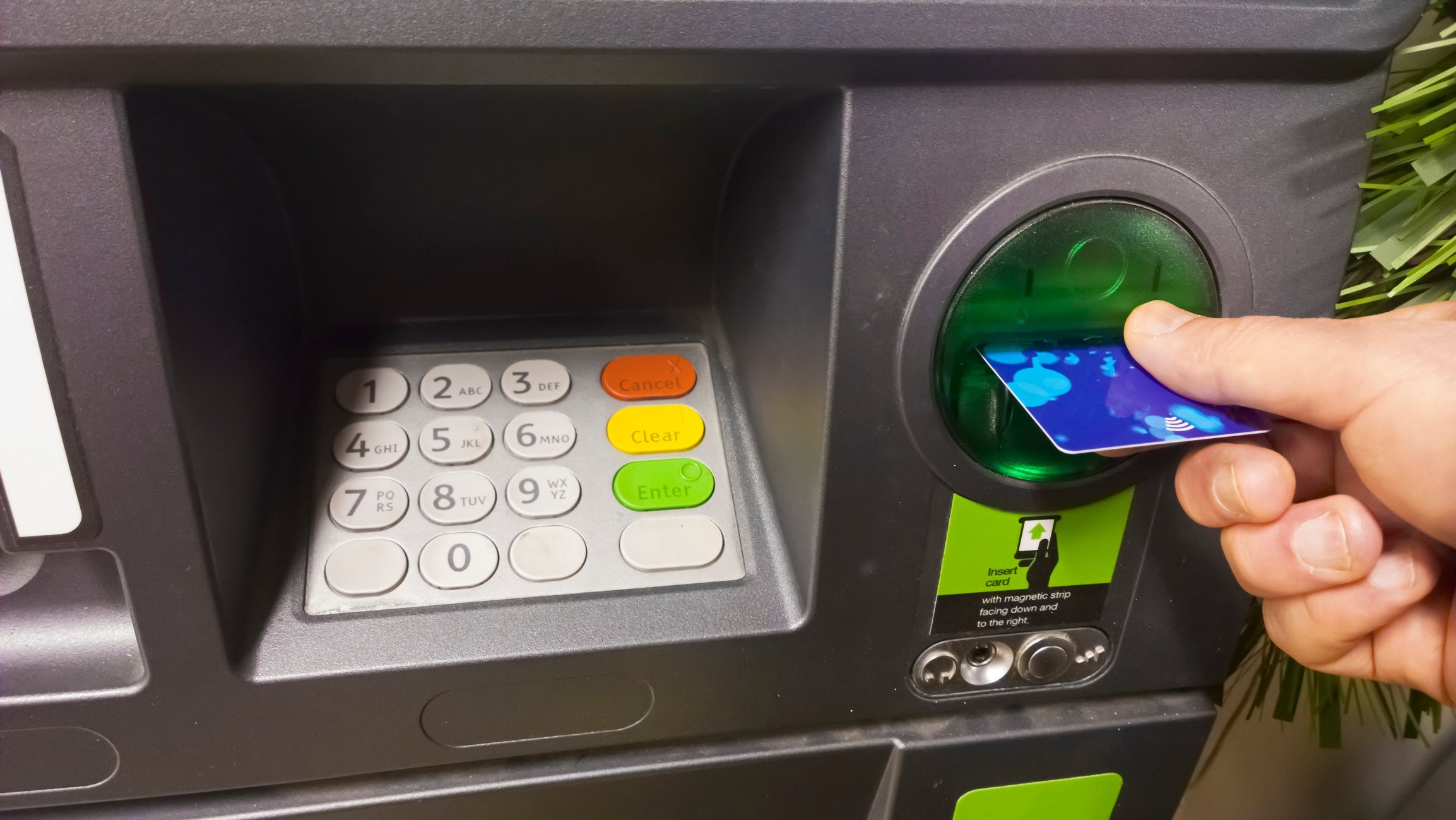 Man using cash machine