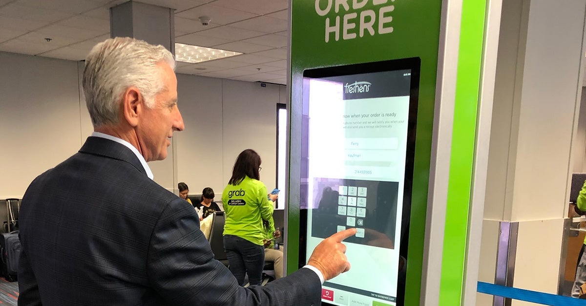 Grab-kiosk-in-use-courtesy-DFW-Airport