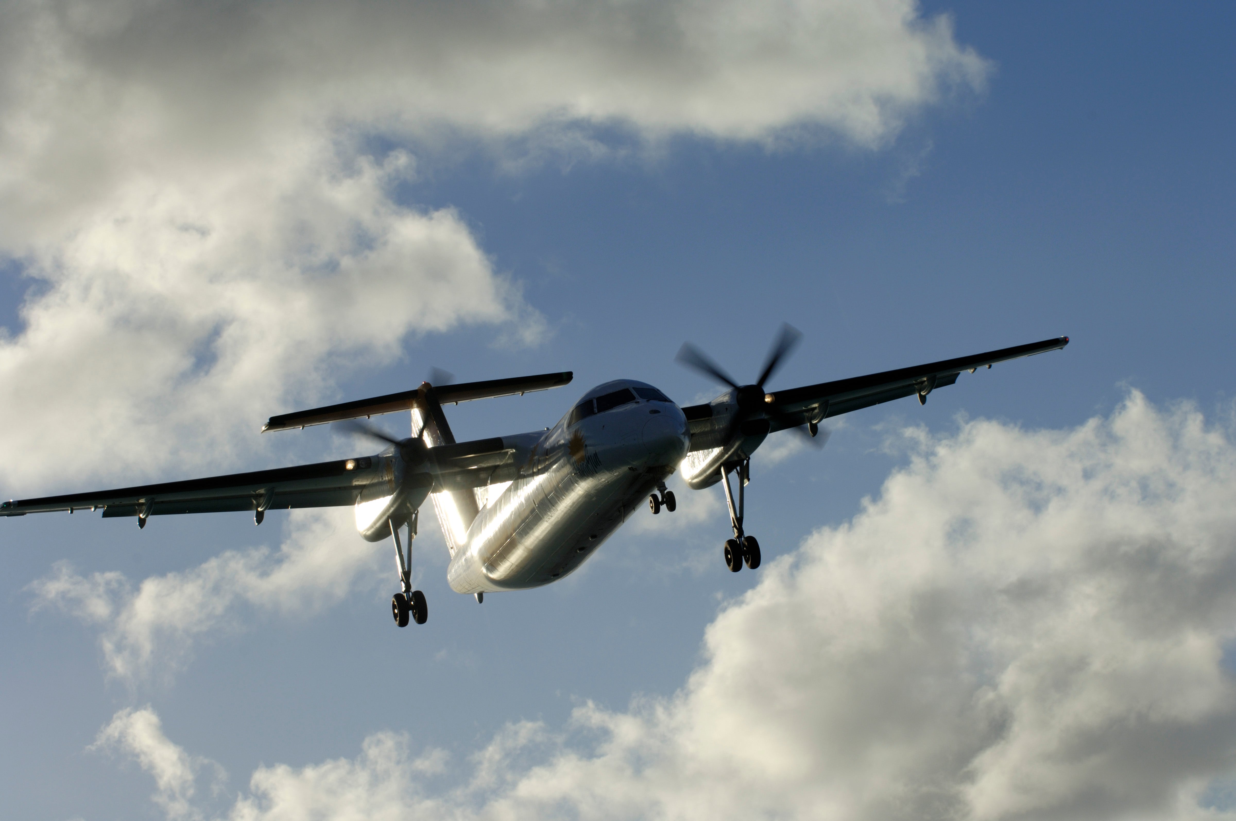 sun glinting off the fuselage and wings
