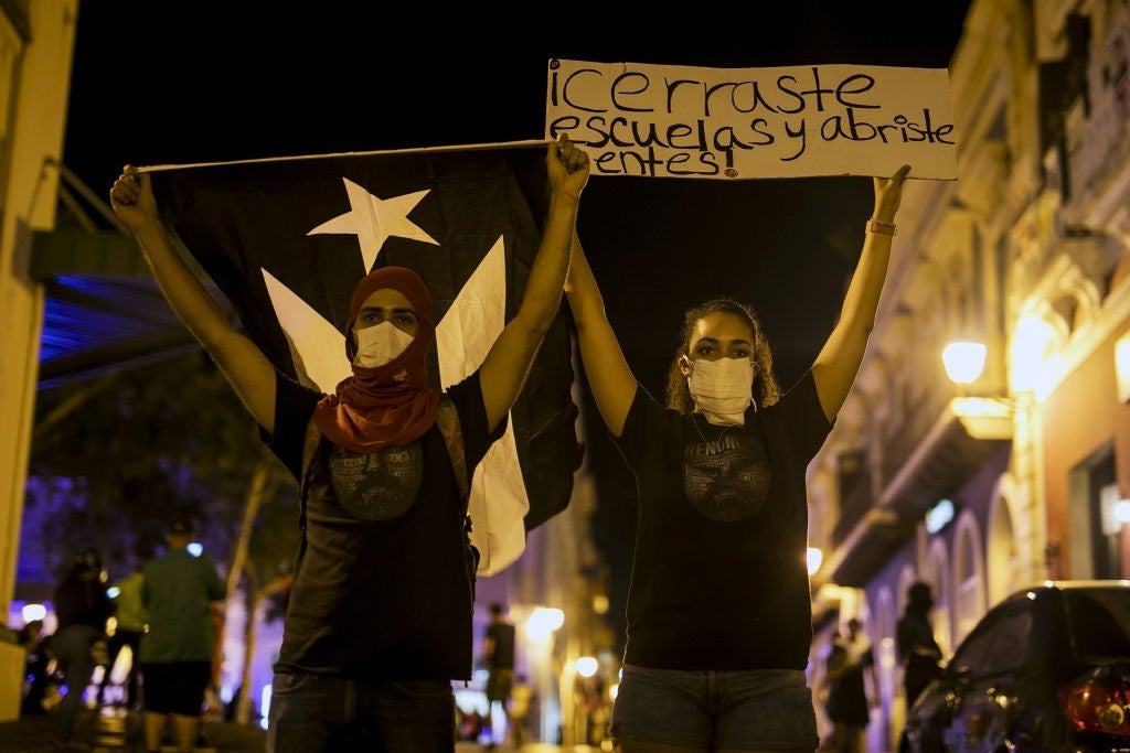 Demonstrators Protest As Governor Bucks Calls For Ouster