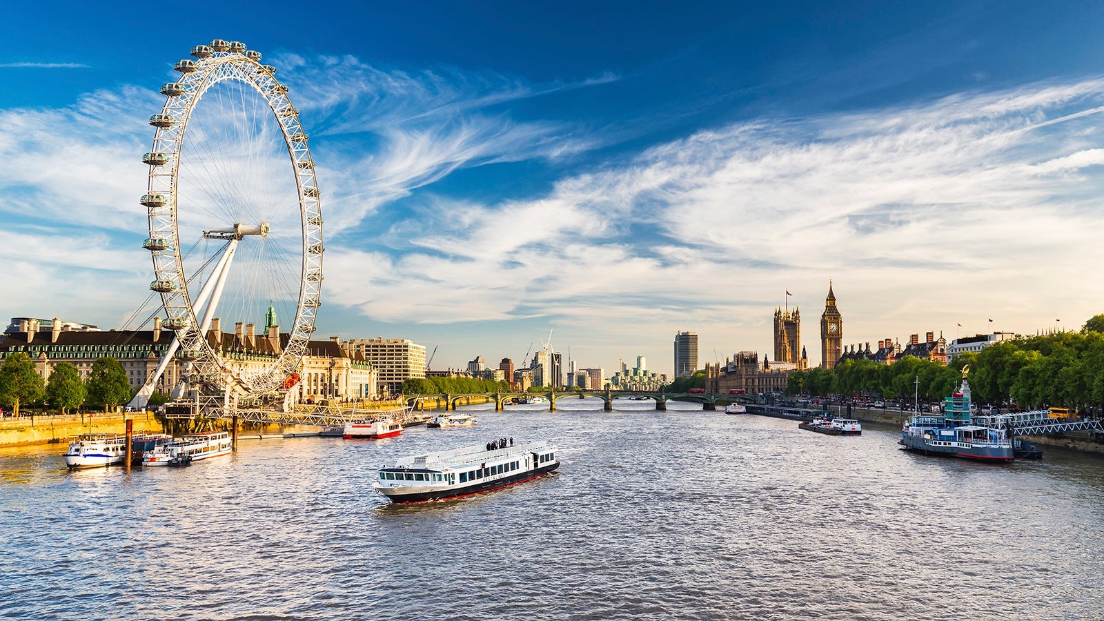 Westminster Parliament, Big Ben and the Thames with blue sky