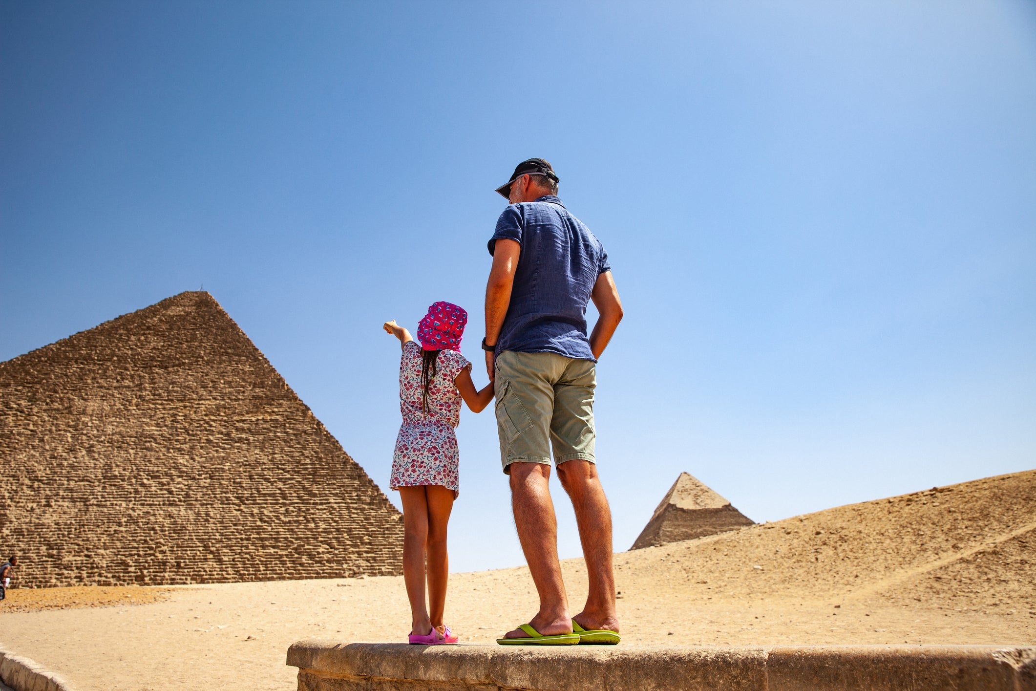 Father and Daughter Looking at Kheops Pyramid in Giza