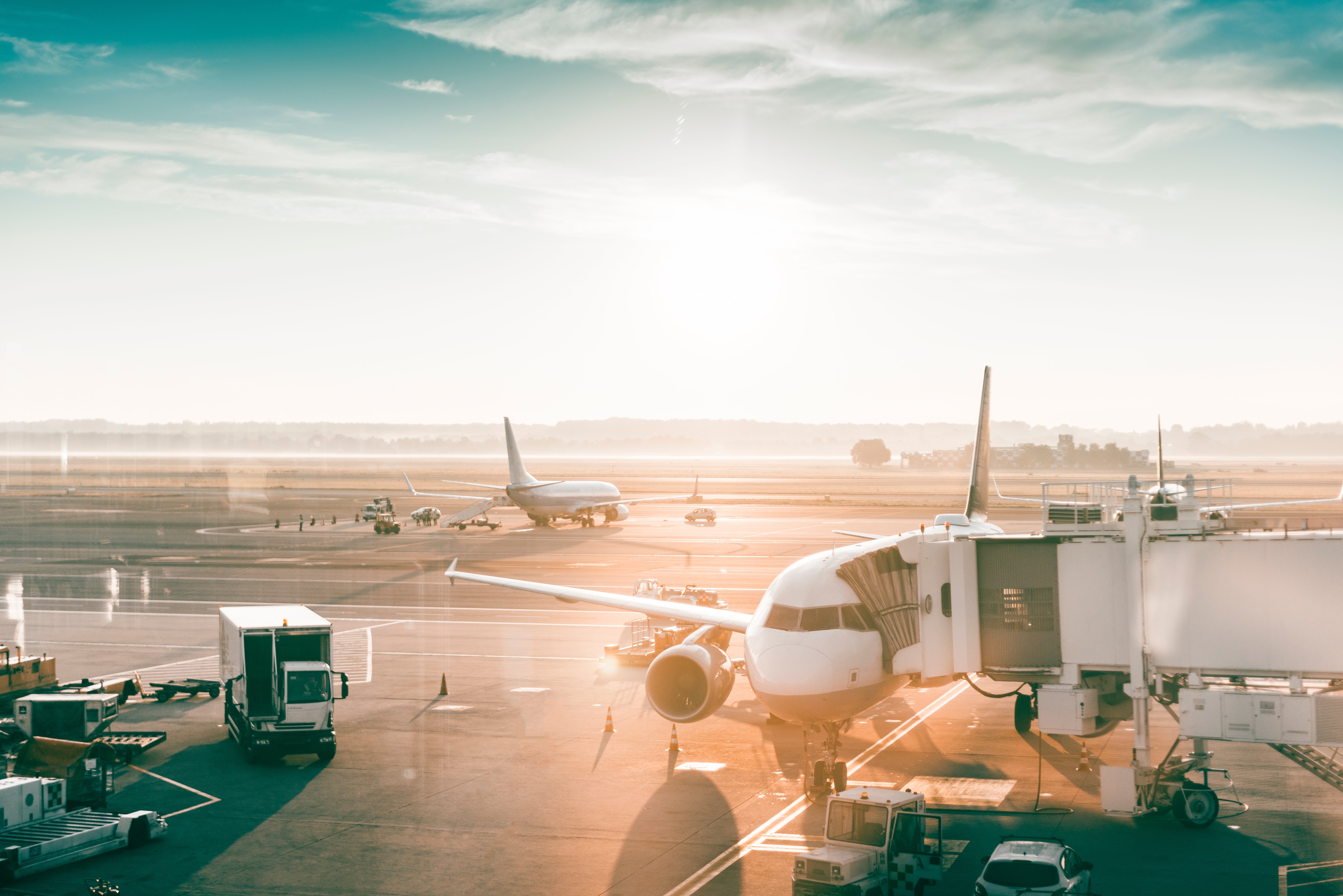 Airplanes in an airport at sunrise