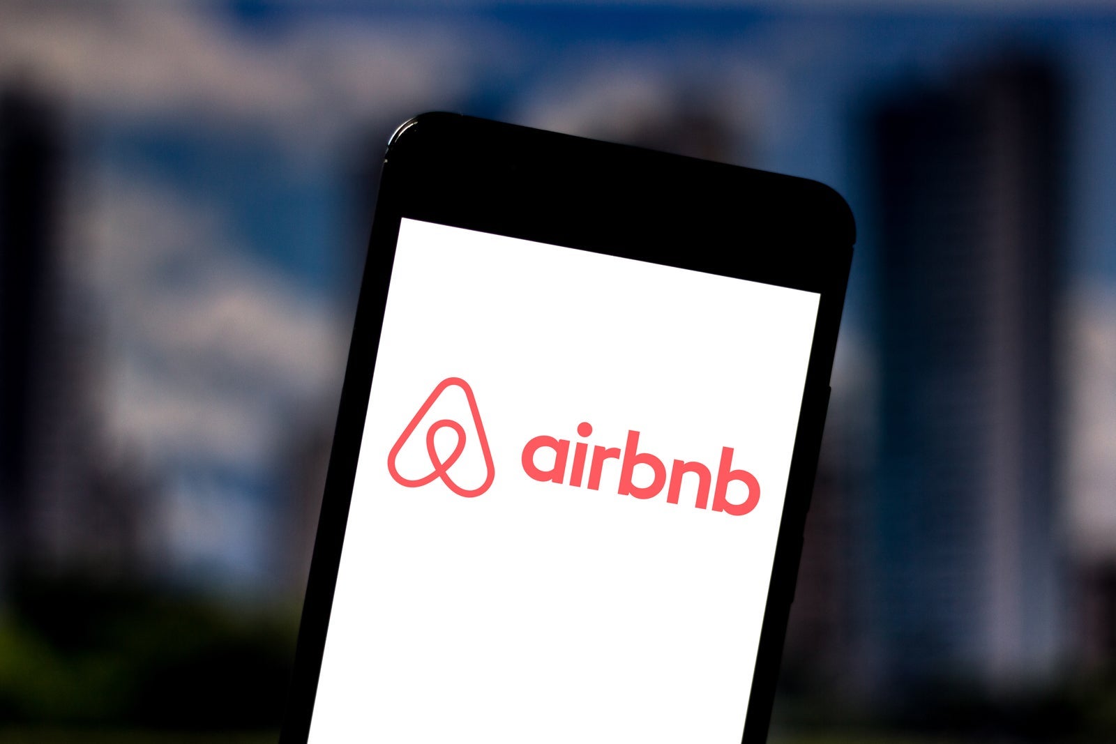 In this photo illustration the Airbnb logo