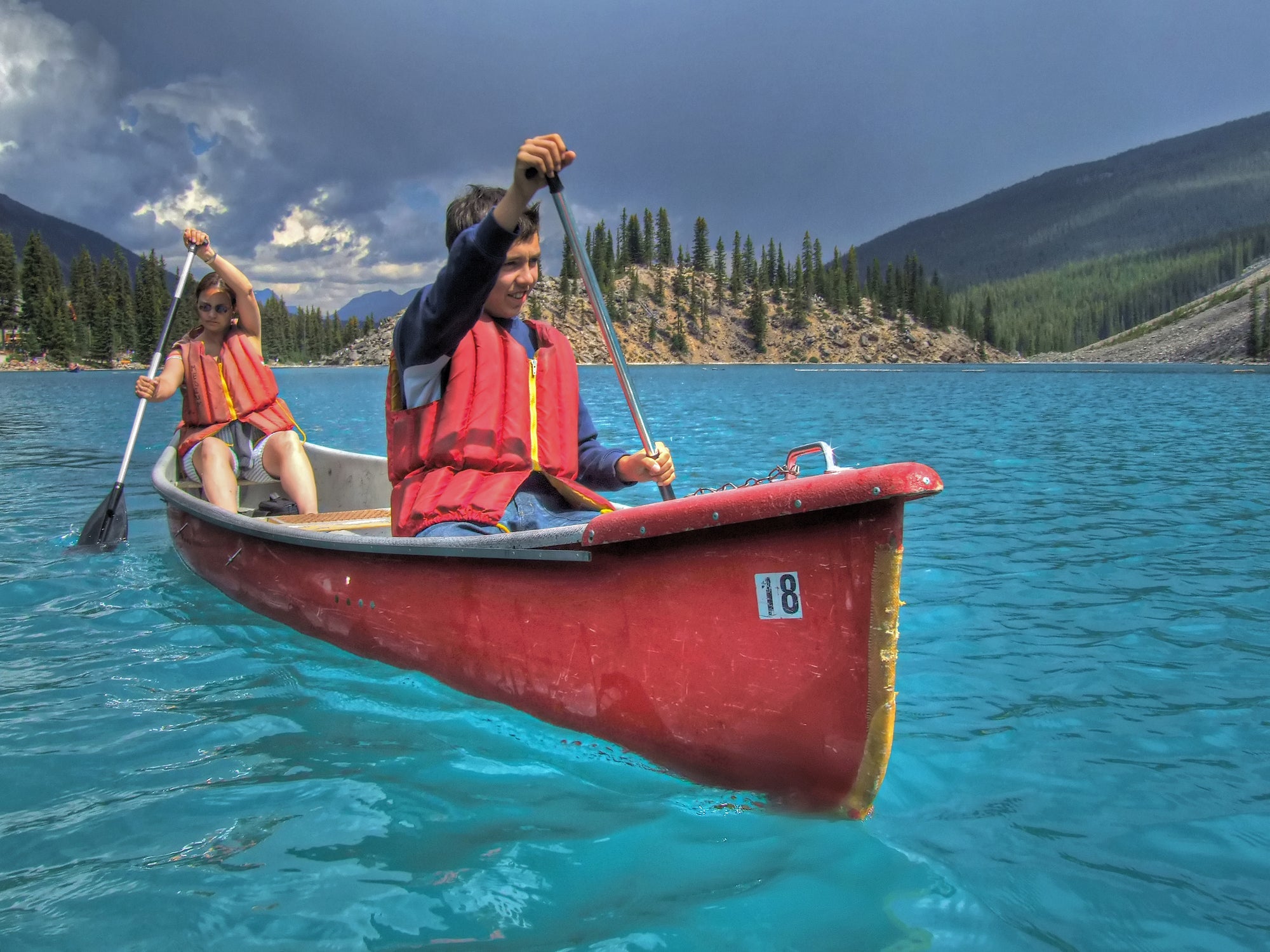 Mother and son canoeing on Lake Moraine