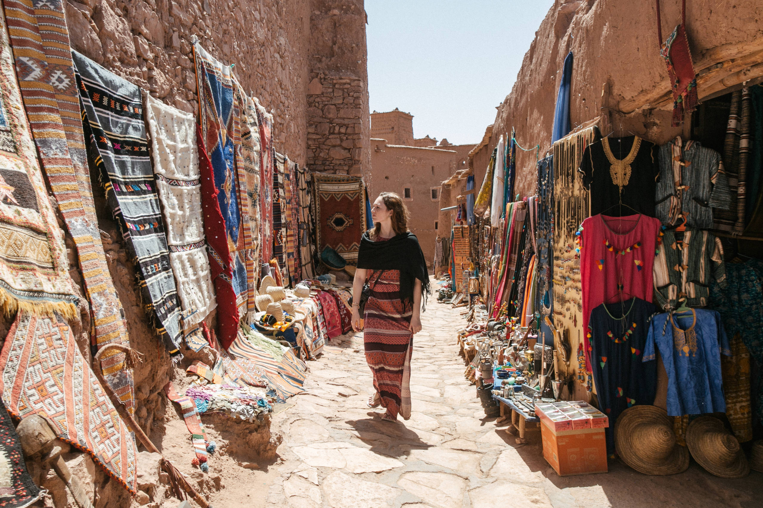 Woman Walking On Footpath At Market