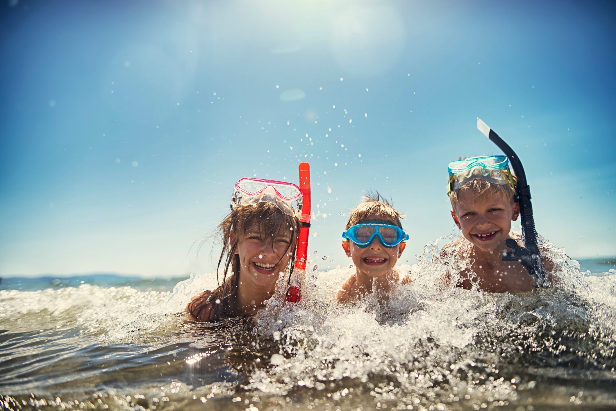 Kids having fun snorkeling in beautiful sea