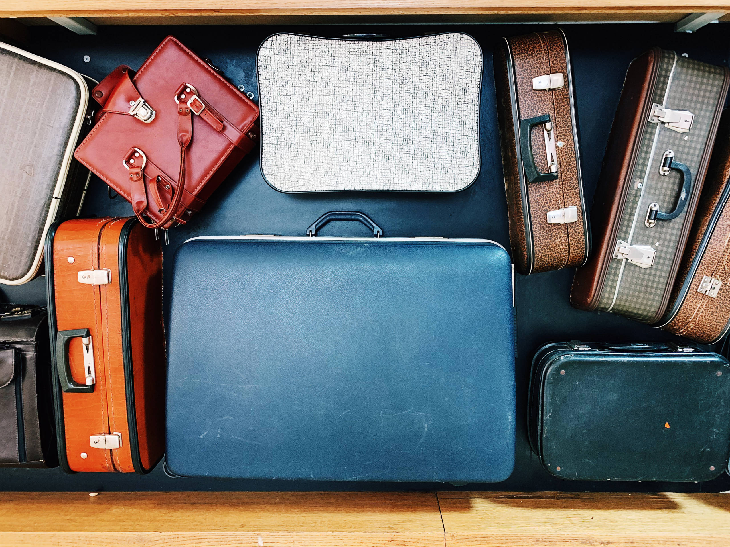 Vintage bags and suitcases on conveyor belt in an airport