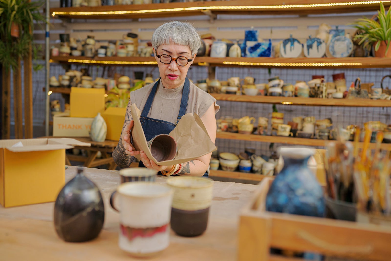 Senior artist customer unpacking subscription box, take out and not satisfied when check on received good quality, online shopping shipment.