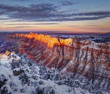 Scenic View Of Mountains Against Sky During Sunset