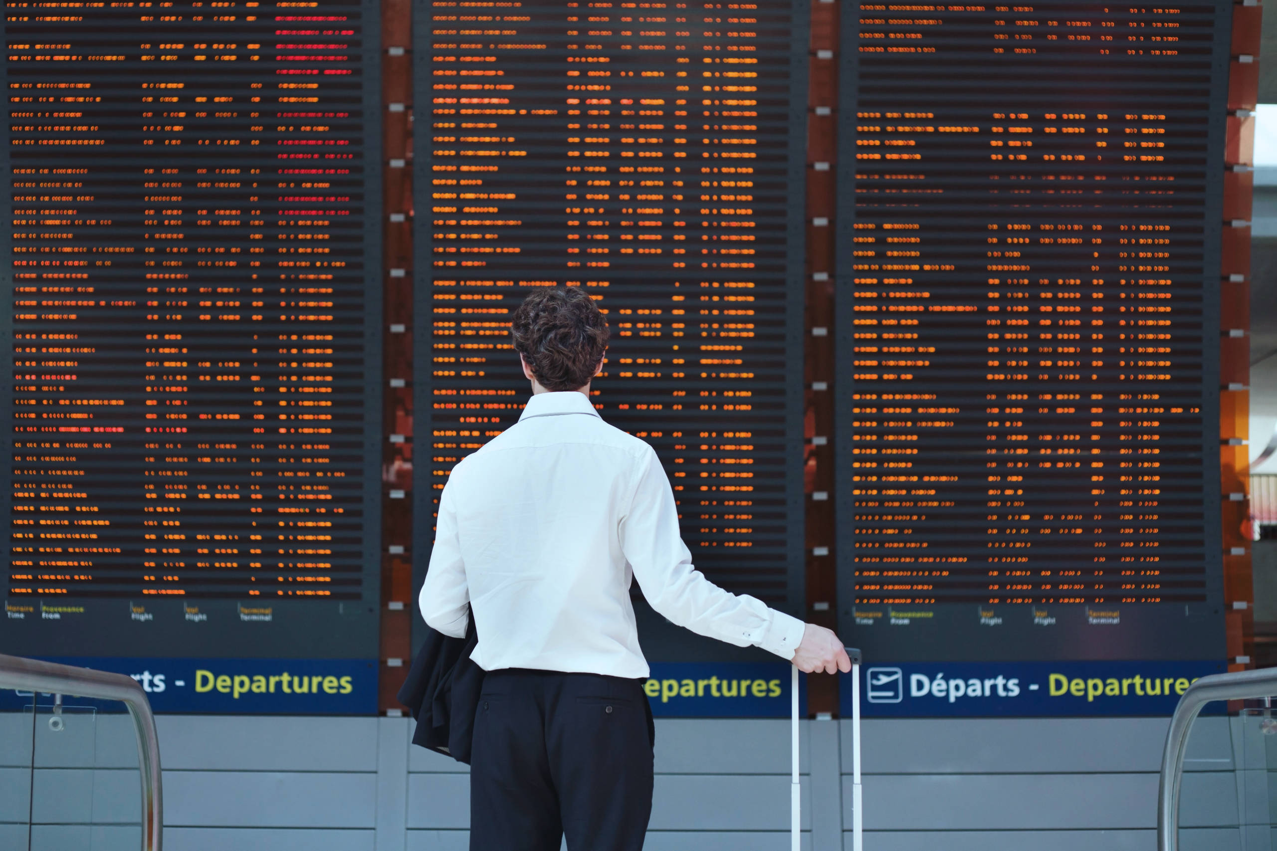 Person In Front of Flight Board