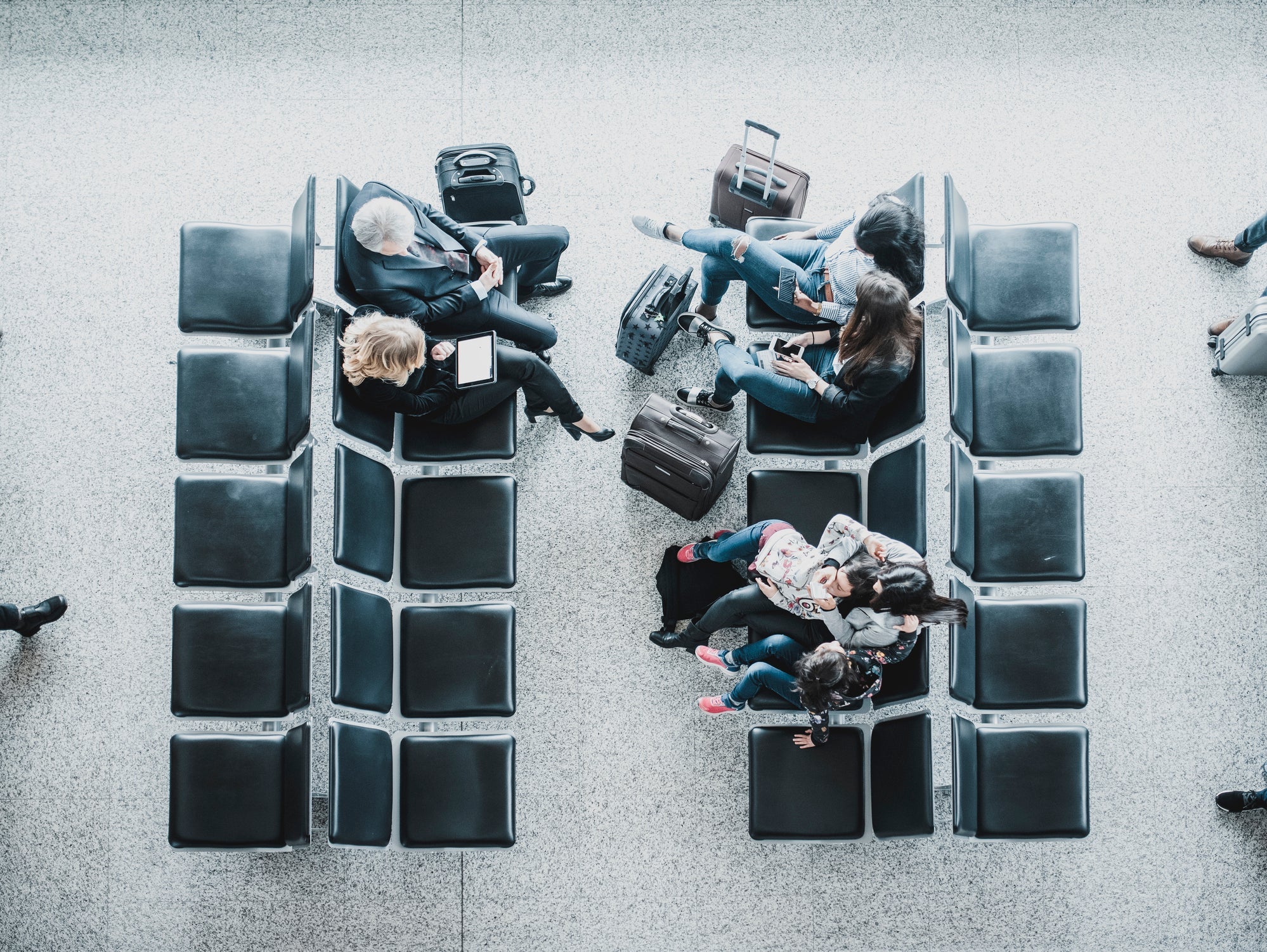 Group of people waiting for a plane in lobby