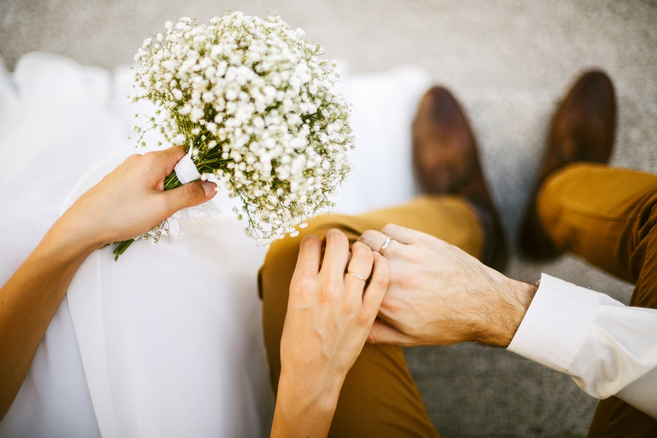 Bride and groom holding their hands together
