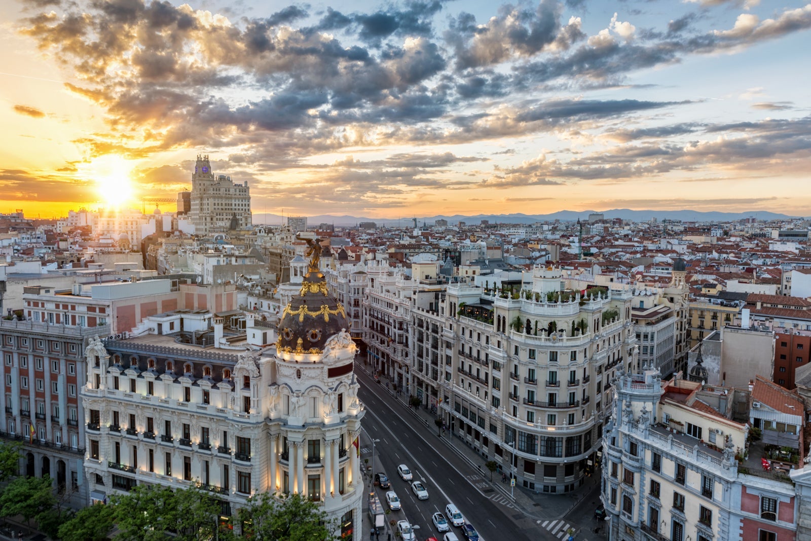 Cityscape Against Cloudy Sky During Sunset