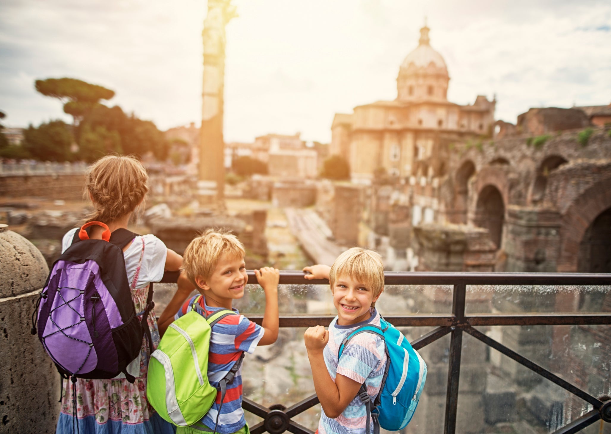 Family visiting Roman Forum in Rome, Italy