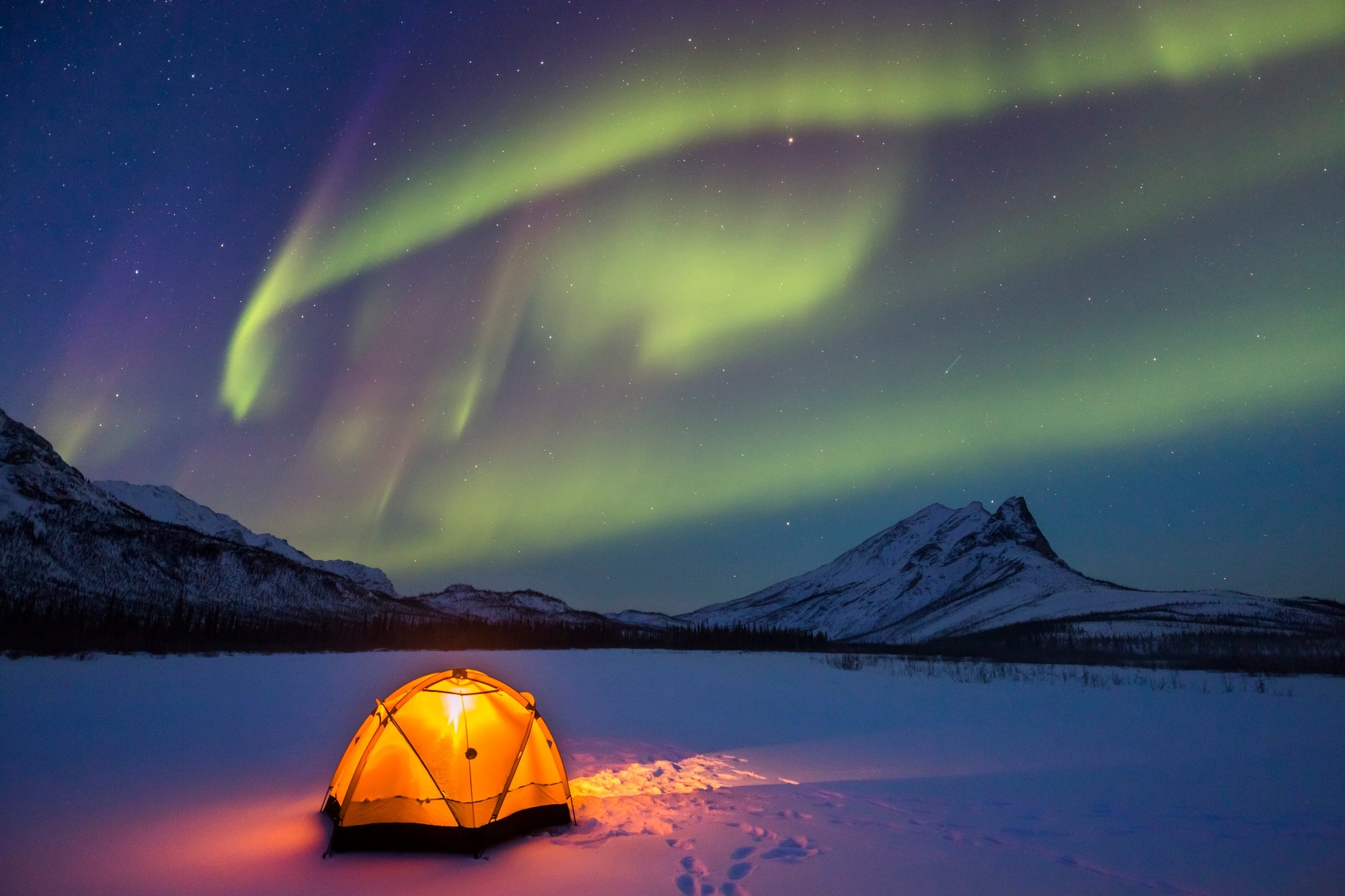 Northern lights over Alaska winter camp