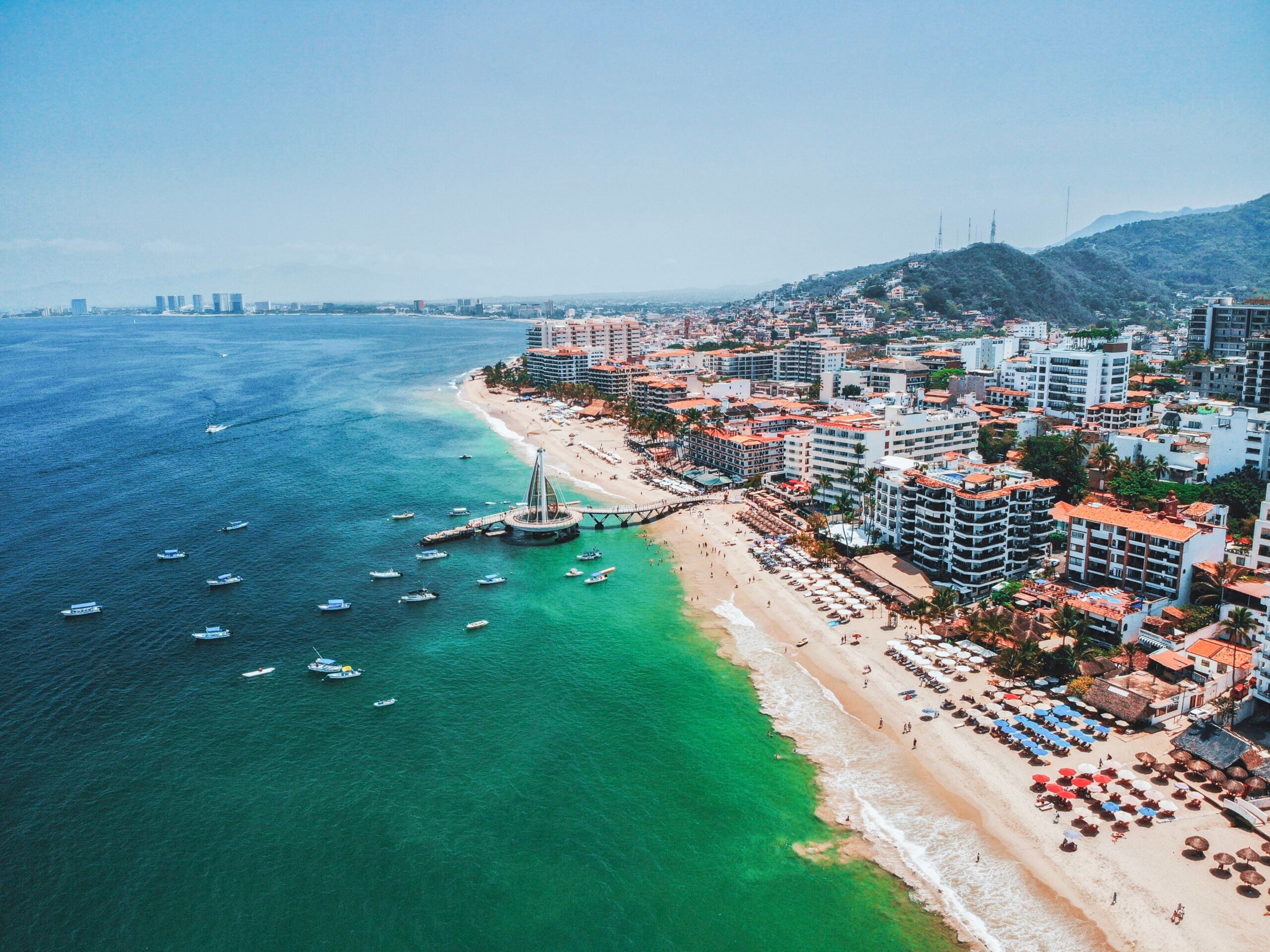 High Angle View Of Sea And Buildings Against Sky
