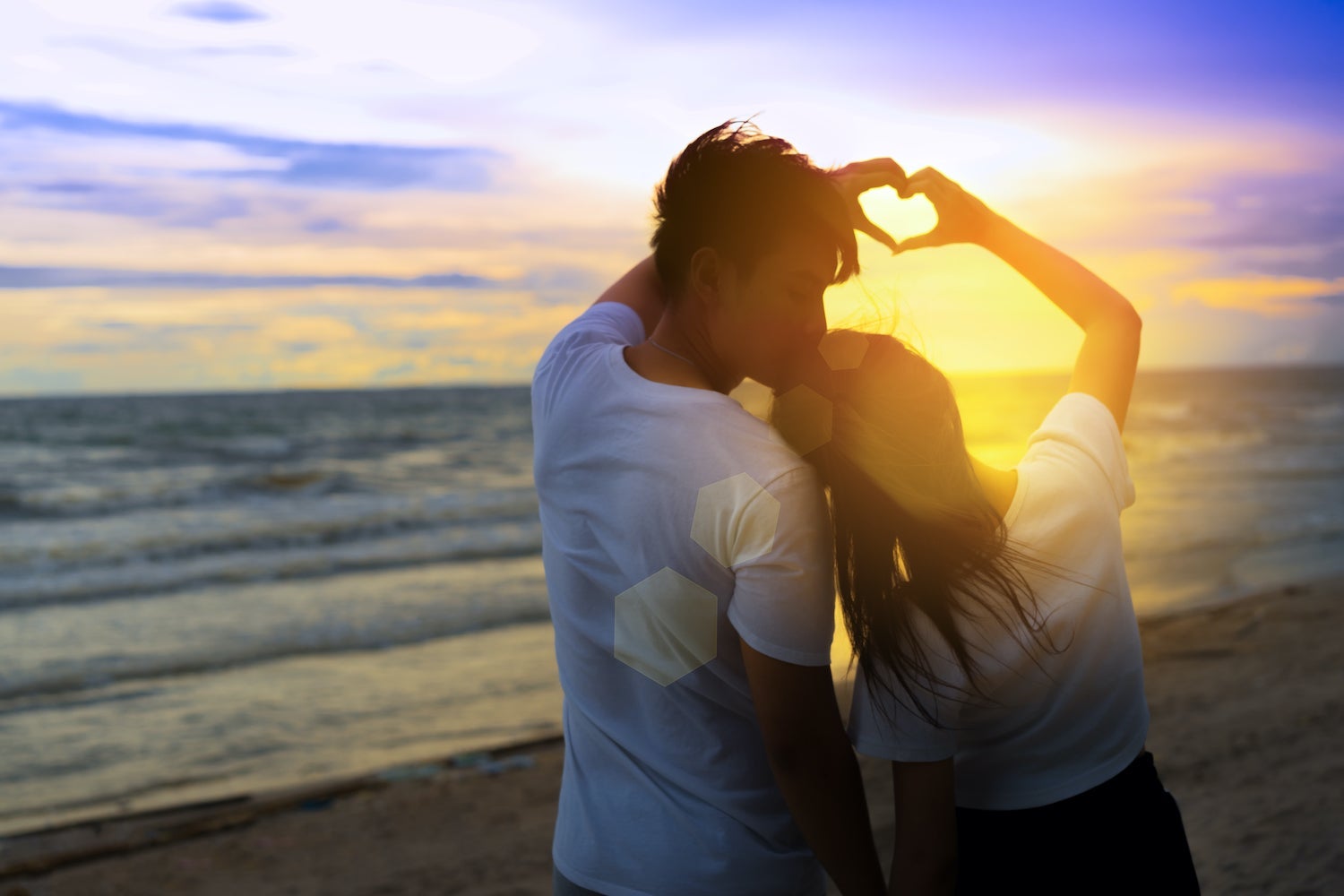 Couple on the beach at sunset