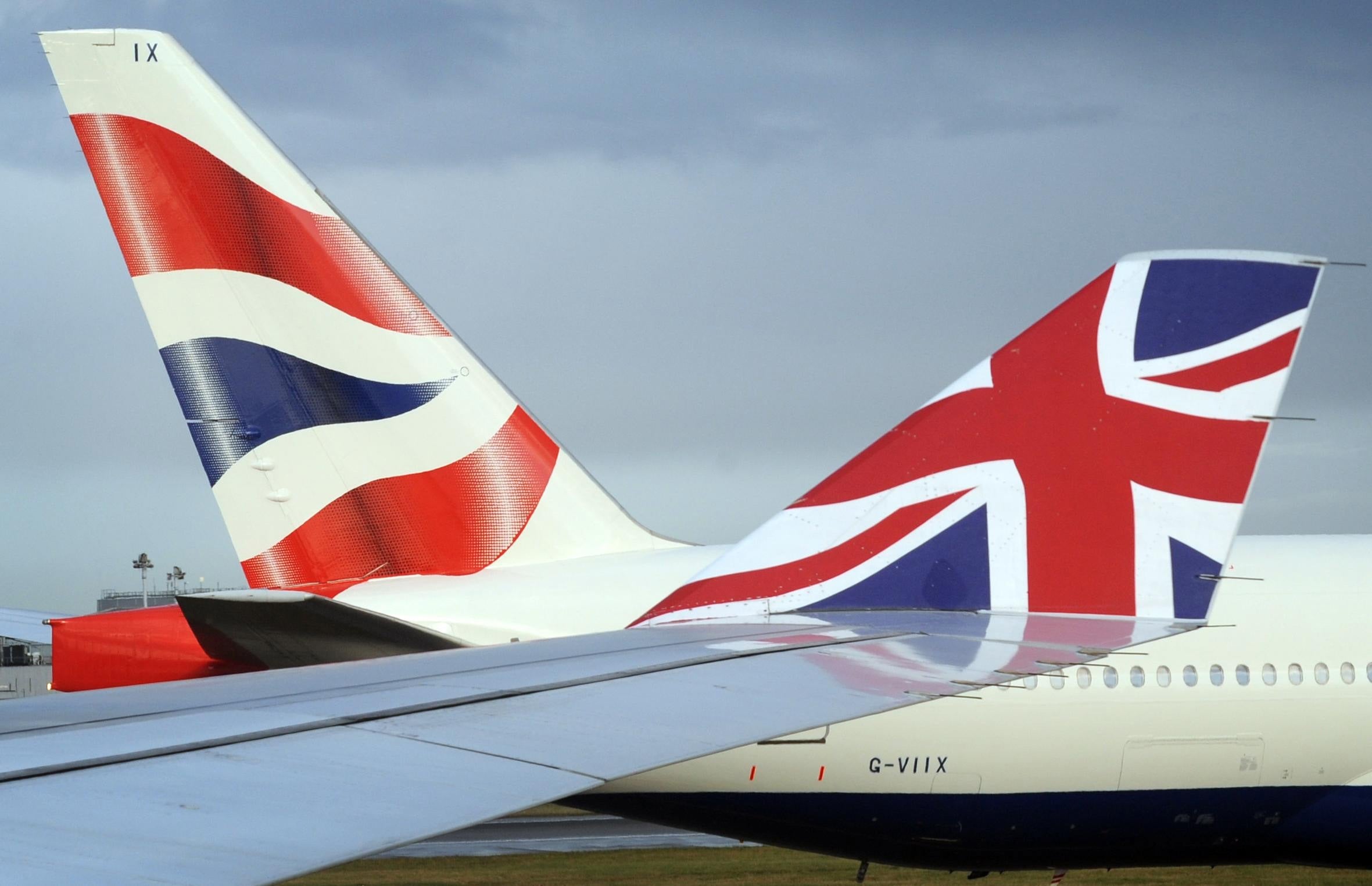 Industrial action by BA staff.A Virgin Atlantic plane taxis past a British Airways plane at Heathrow Airport. British Airways has launched legal action in a bid to halt a planned 12-day strike by its cabin crew, which threatens travel chaos for a million passengers from next week.