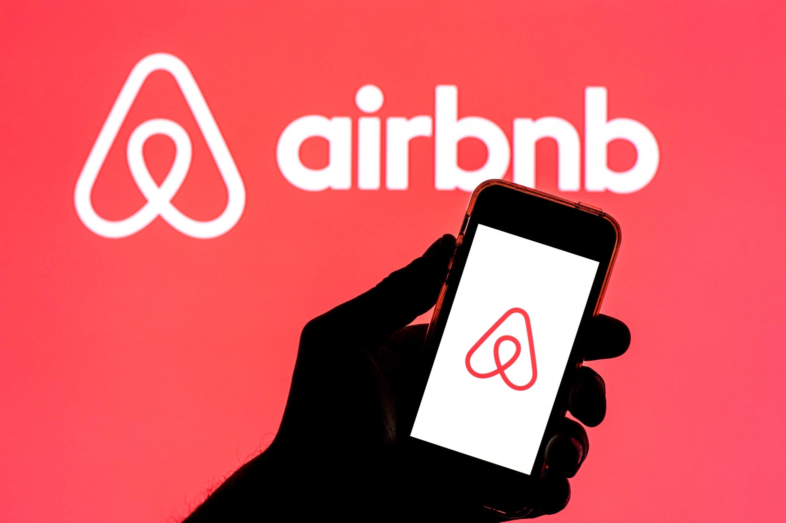 In this photo illustration, the Airbnb app seen displayed on