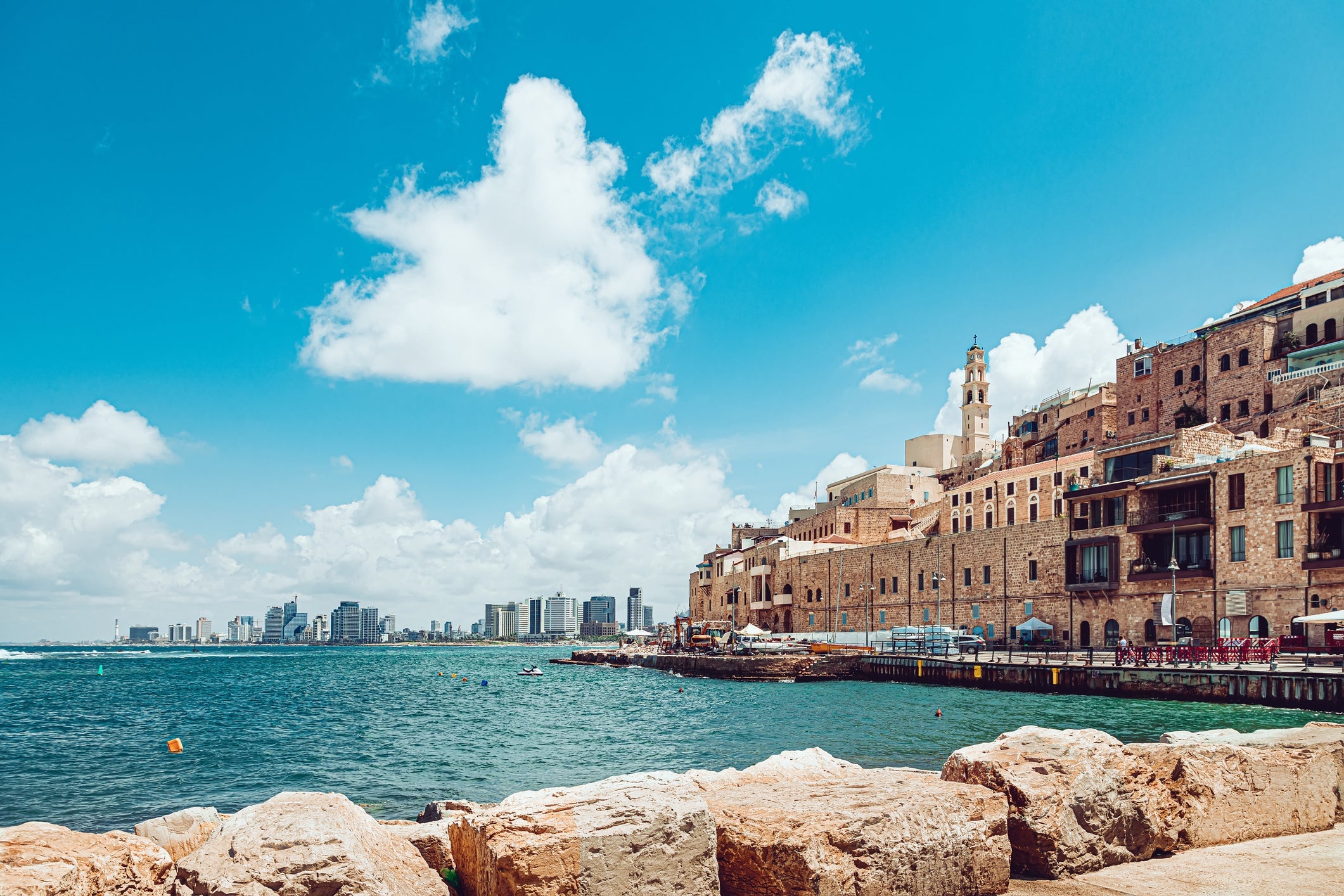 Old Jaffa and distant view of modern Tel Aviv buildings.