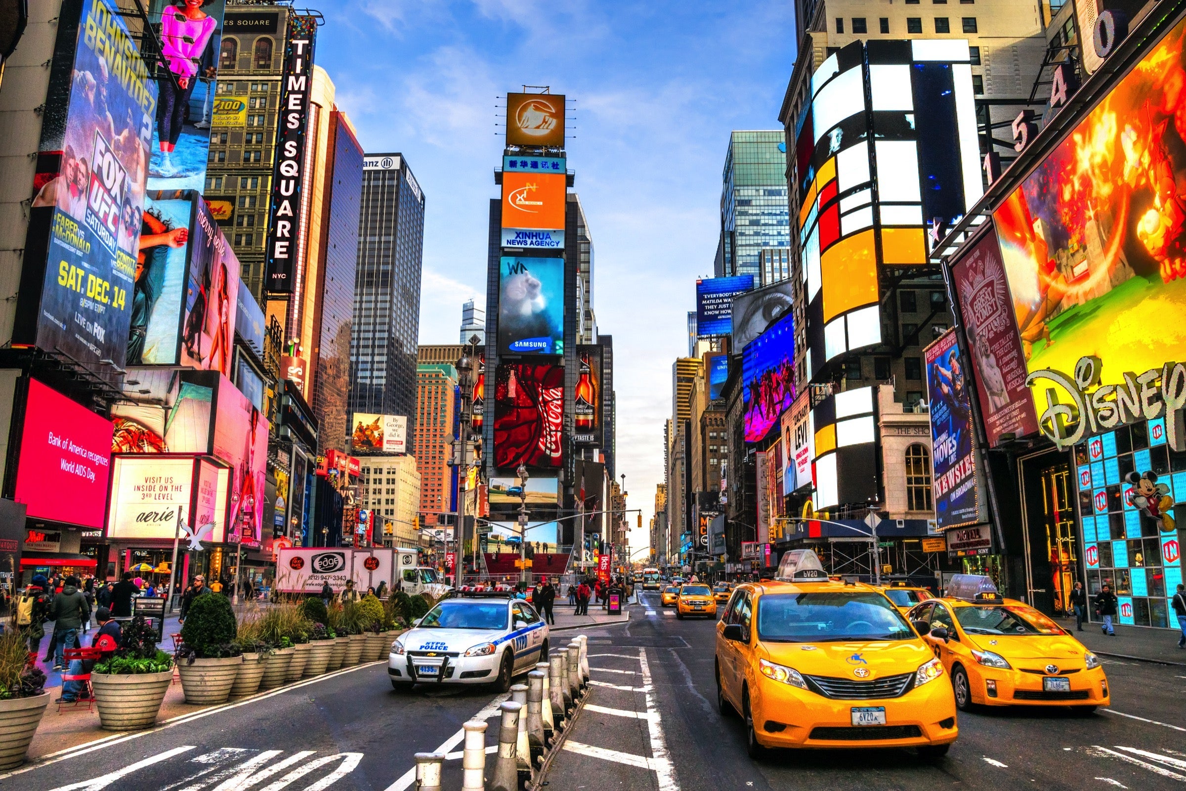 Times Square with two yellow NYC taxis