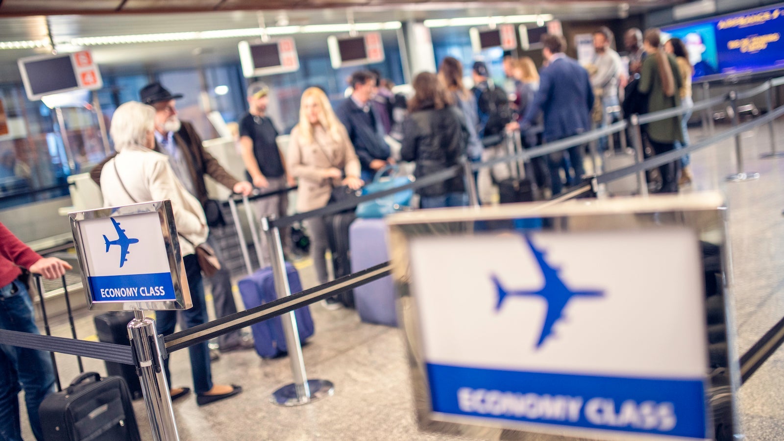 Airline passengers waiting in line