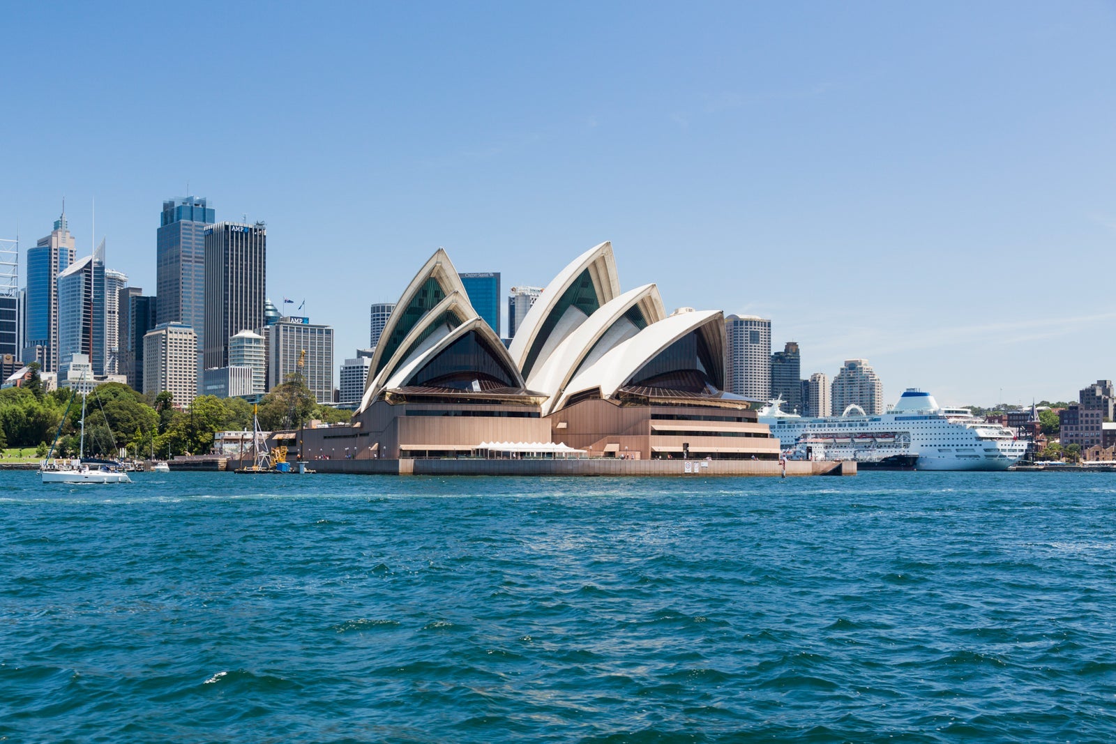 Central business district of Sydney and the Opera House with P&O Pacific Pearl Cruise ship docked in the harbor, Australia