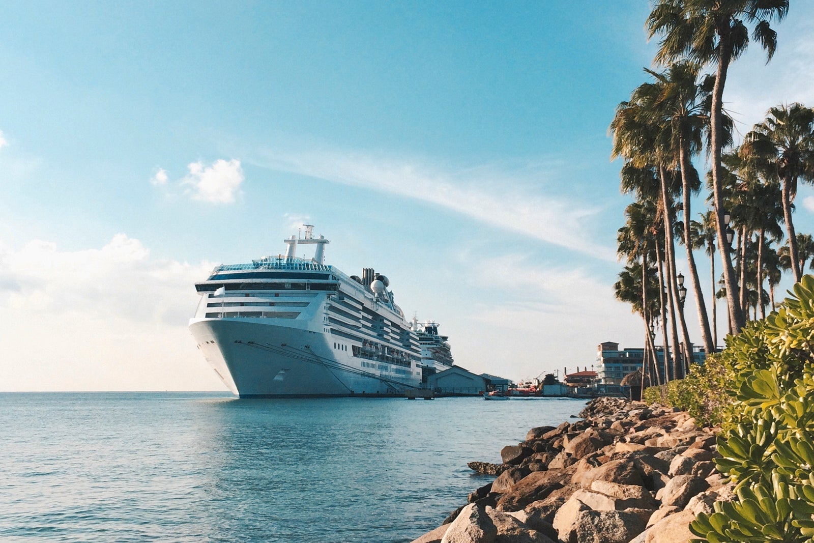 Cruise ship sailing on sea against blue sky