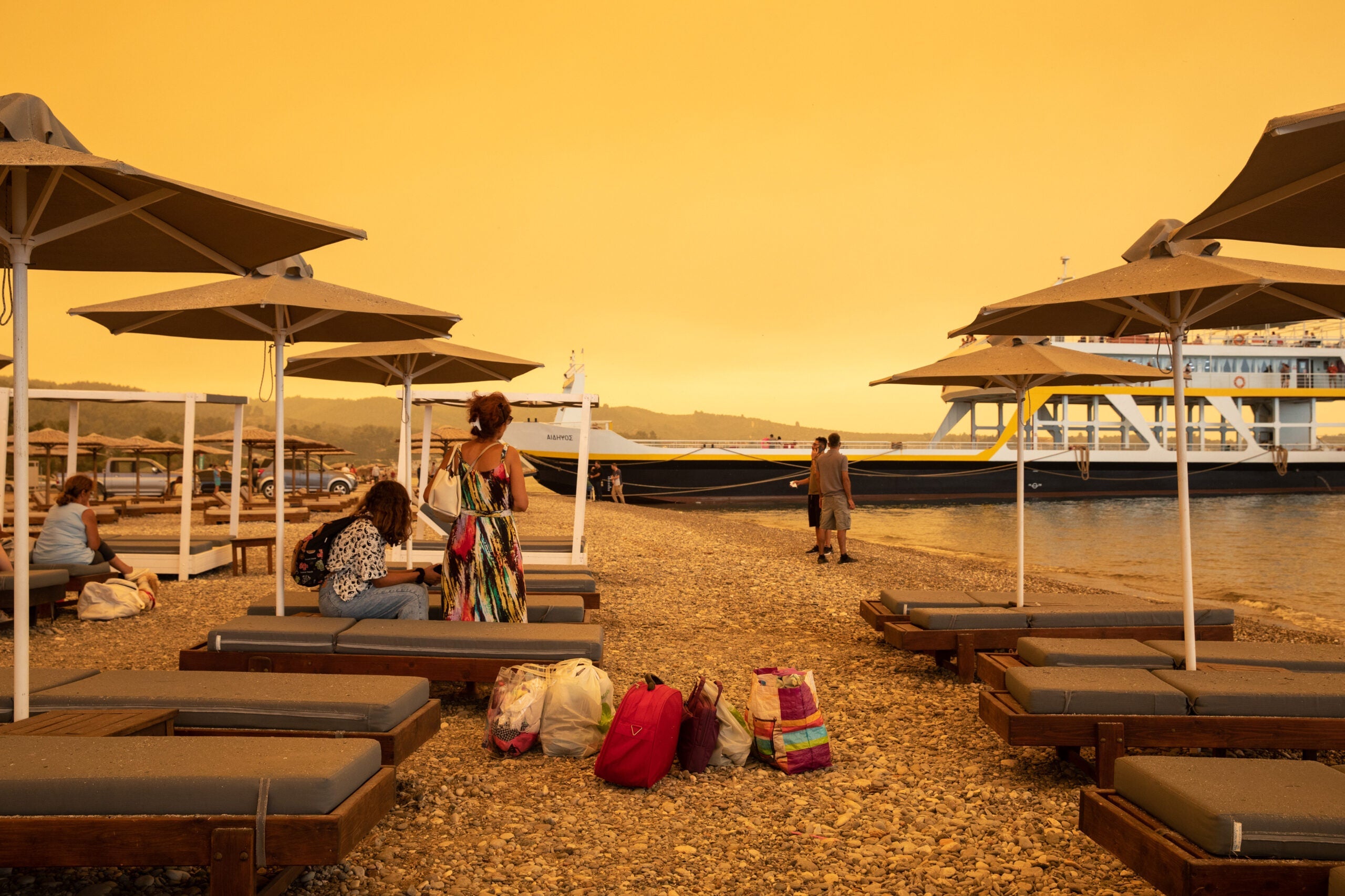 Residents Evacuate Greek Island Hit By Wildfires