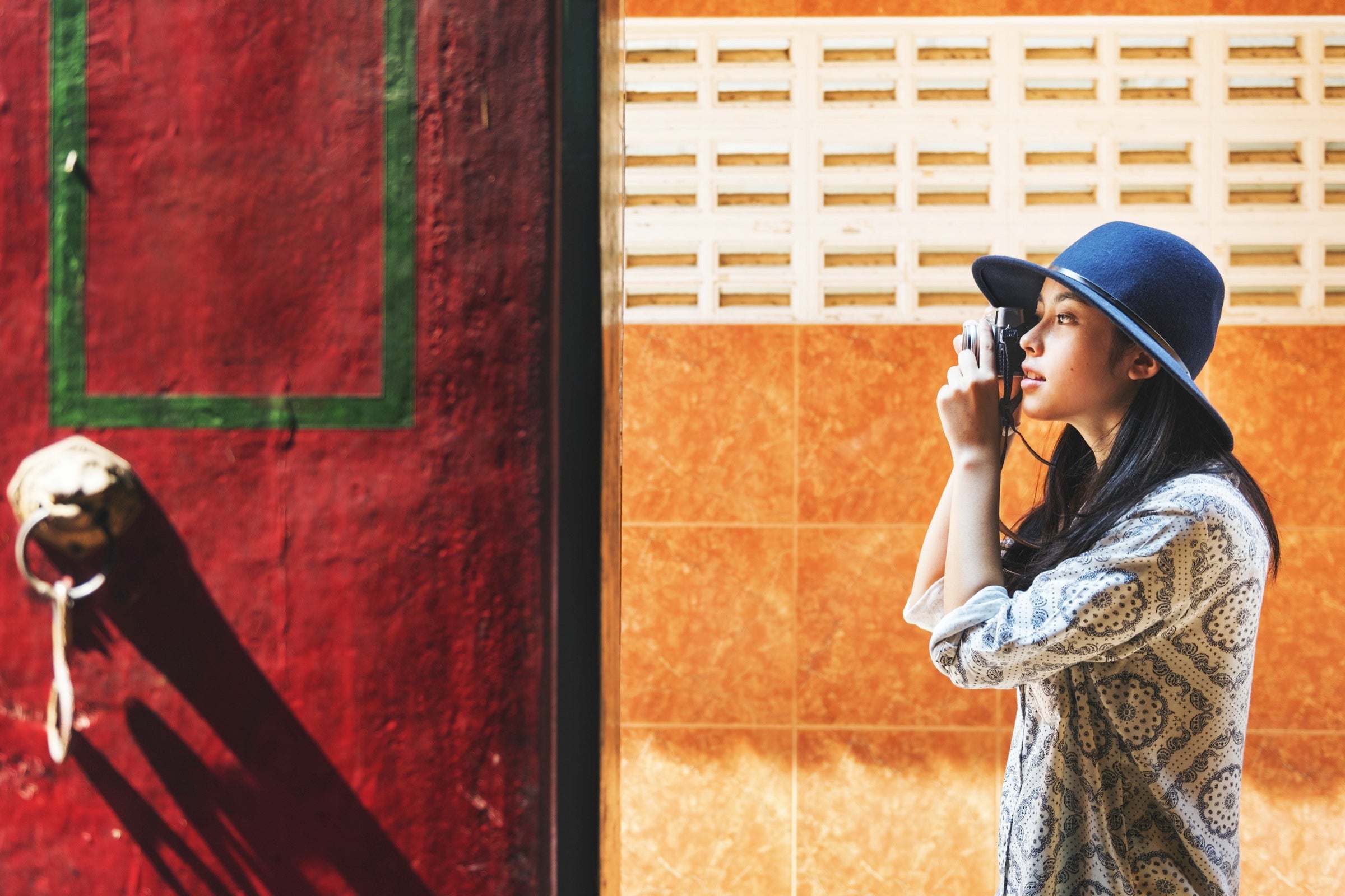 A female traveler taking a photograph