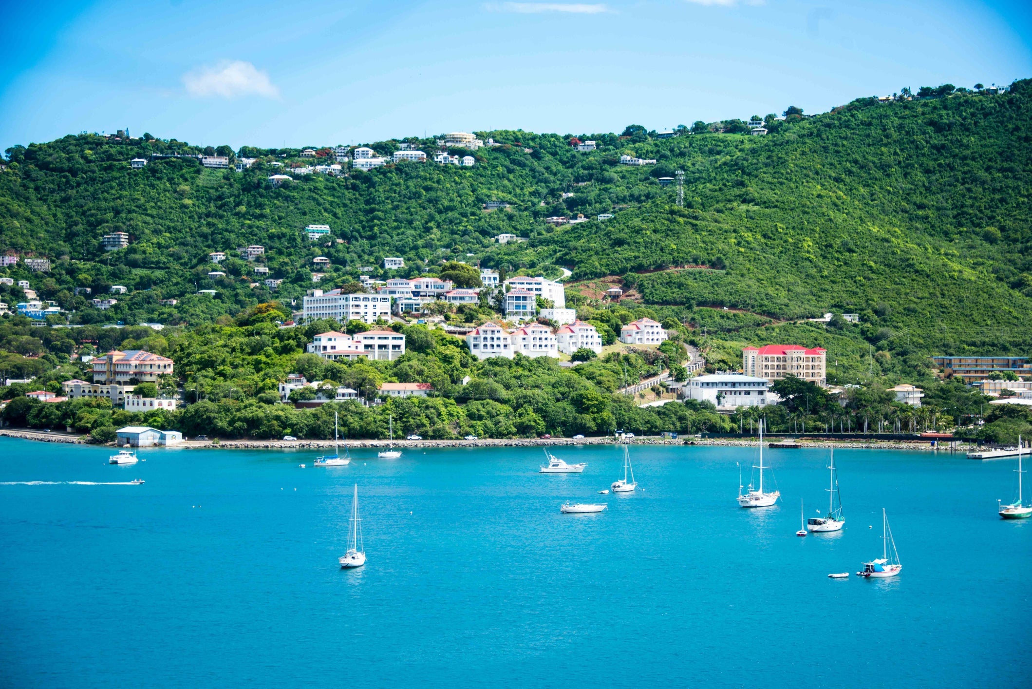 Sailboats Moored In Sea Against Sky