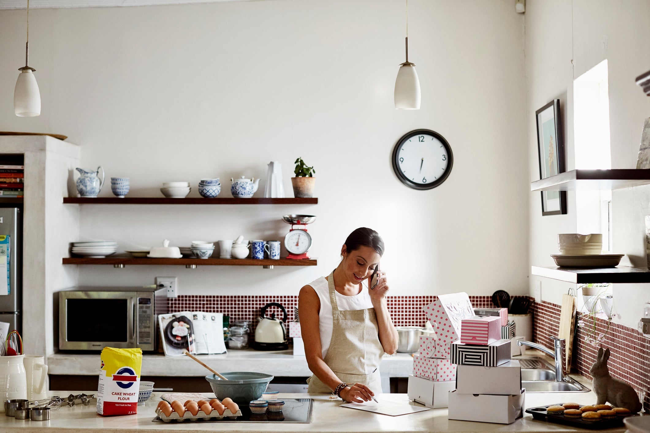 Woman taking order for cupcakes