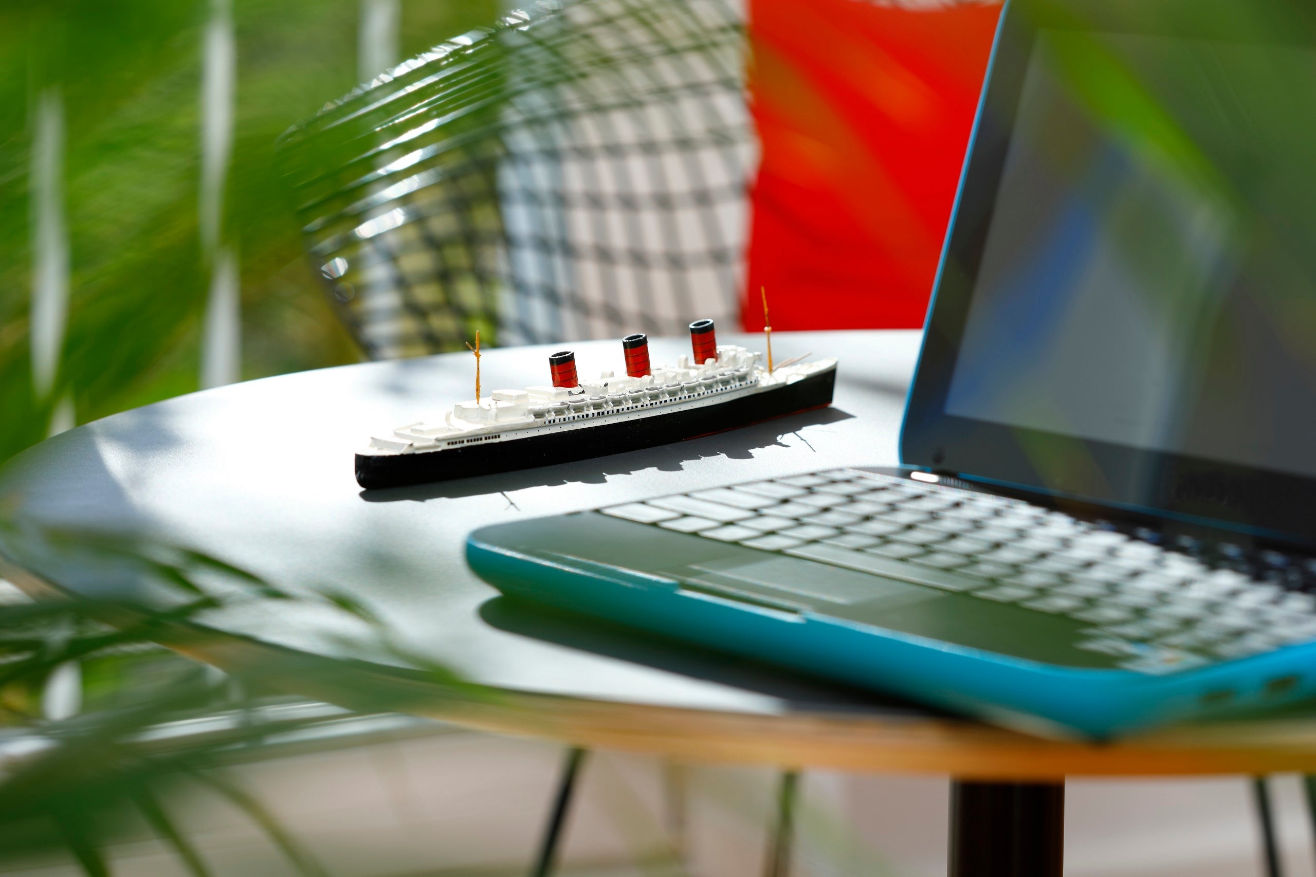Laptop and Ship model on a Coffee table