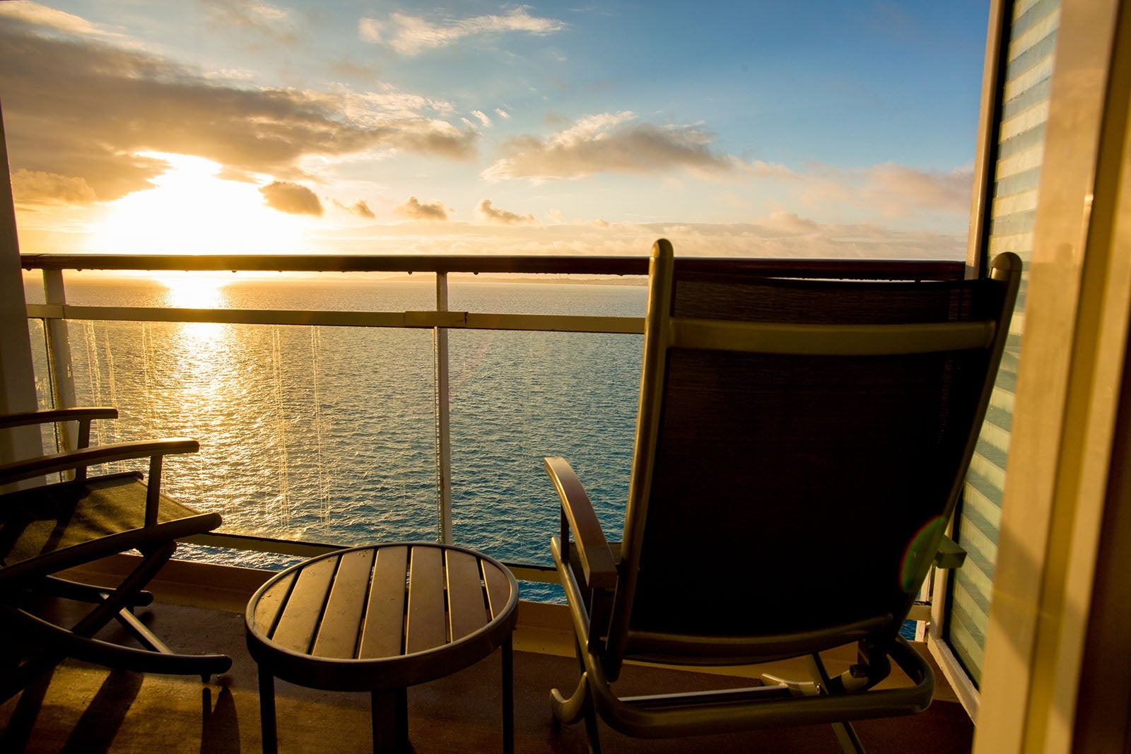 Empty Deck Chair on a Cruise Ship Balcony at Dusk