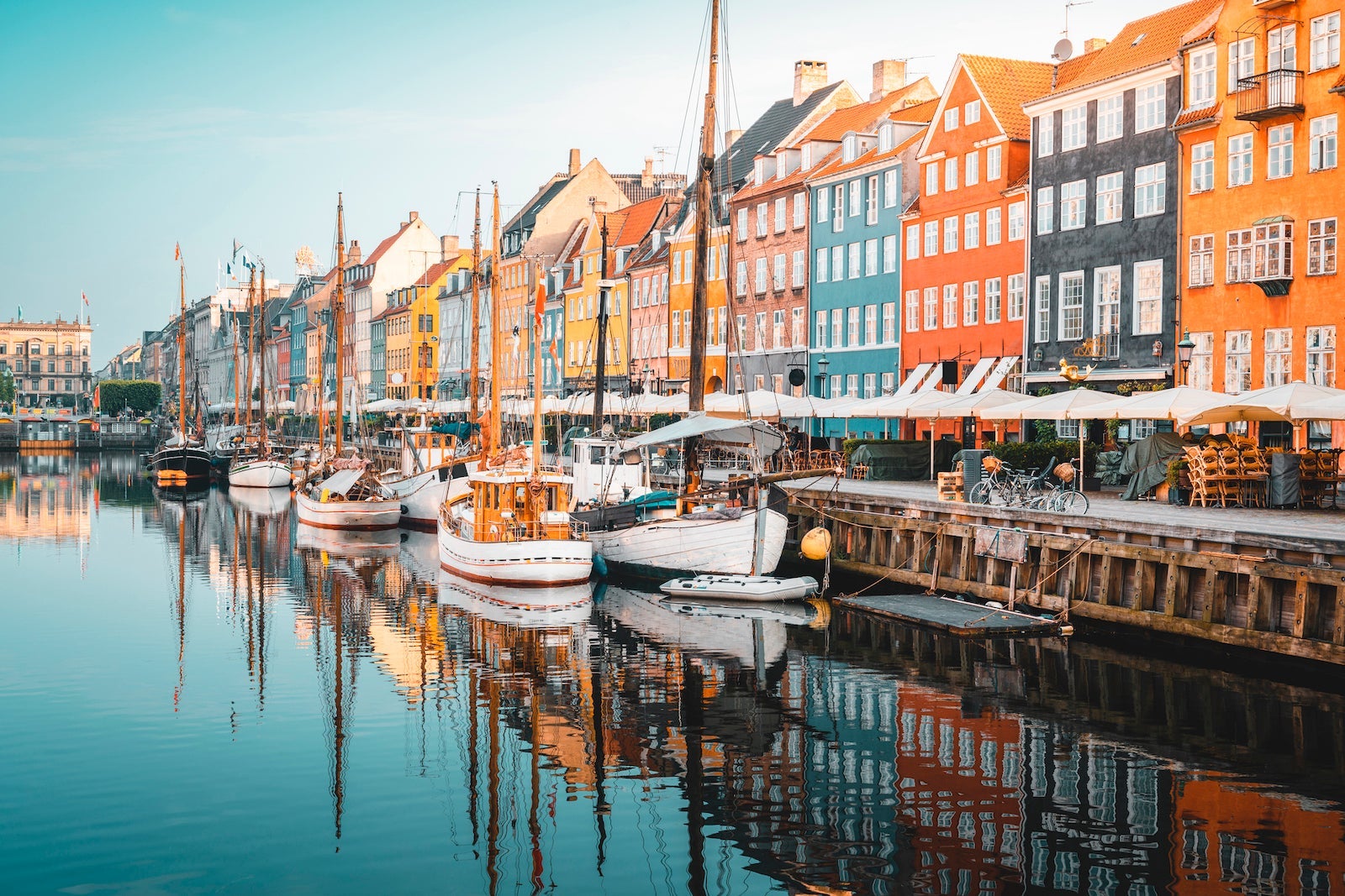 Colourful townhouses facades and old ships along the Nyhavn Canal, Copenhagen