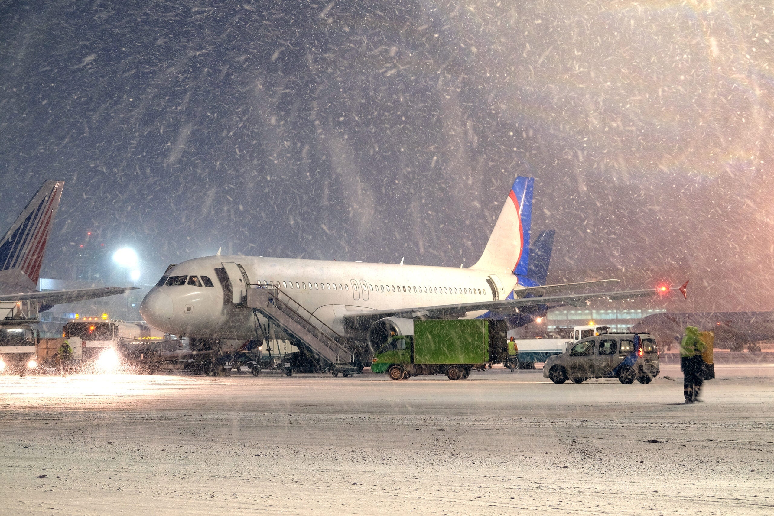 commercial airplane parking at the airport in winter