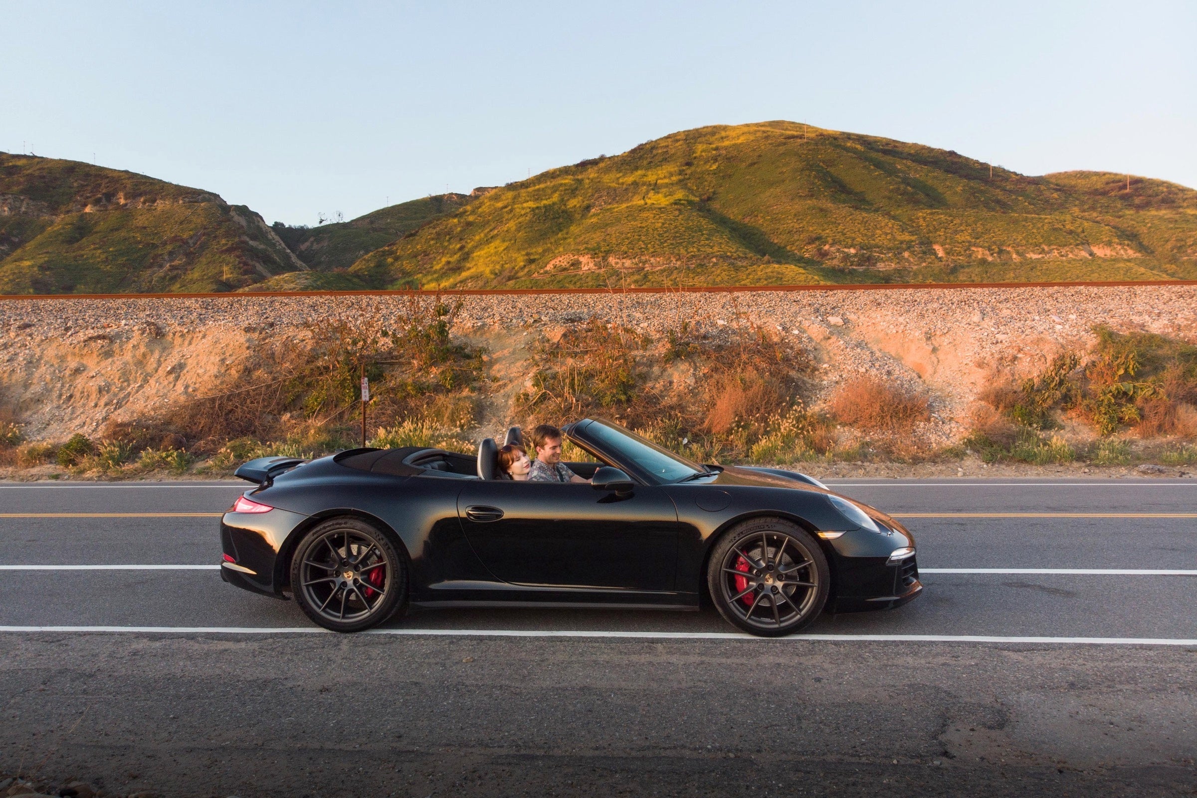Person driving a Porsche