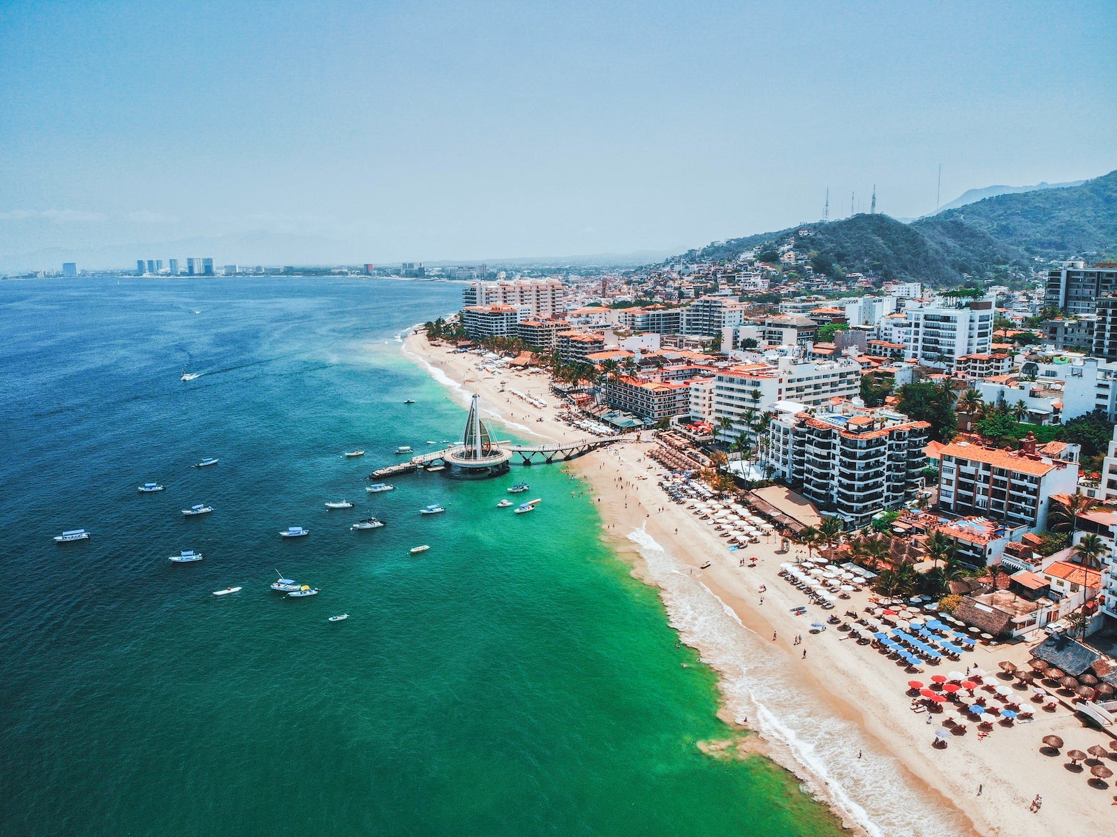 High Angle View Of Sea And Buildings Against Sky