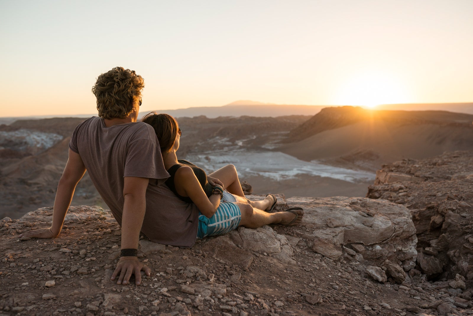 Couple on cliff, Valle de la Luna (Valley of the Moon), Atacama Desert, El Norte Grande, Chile