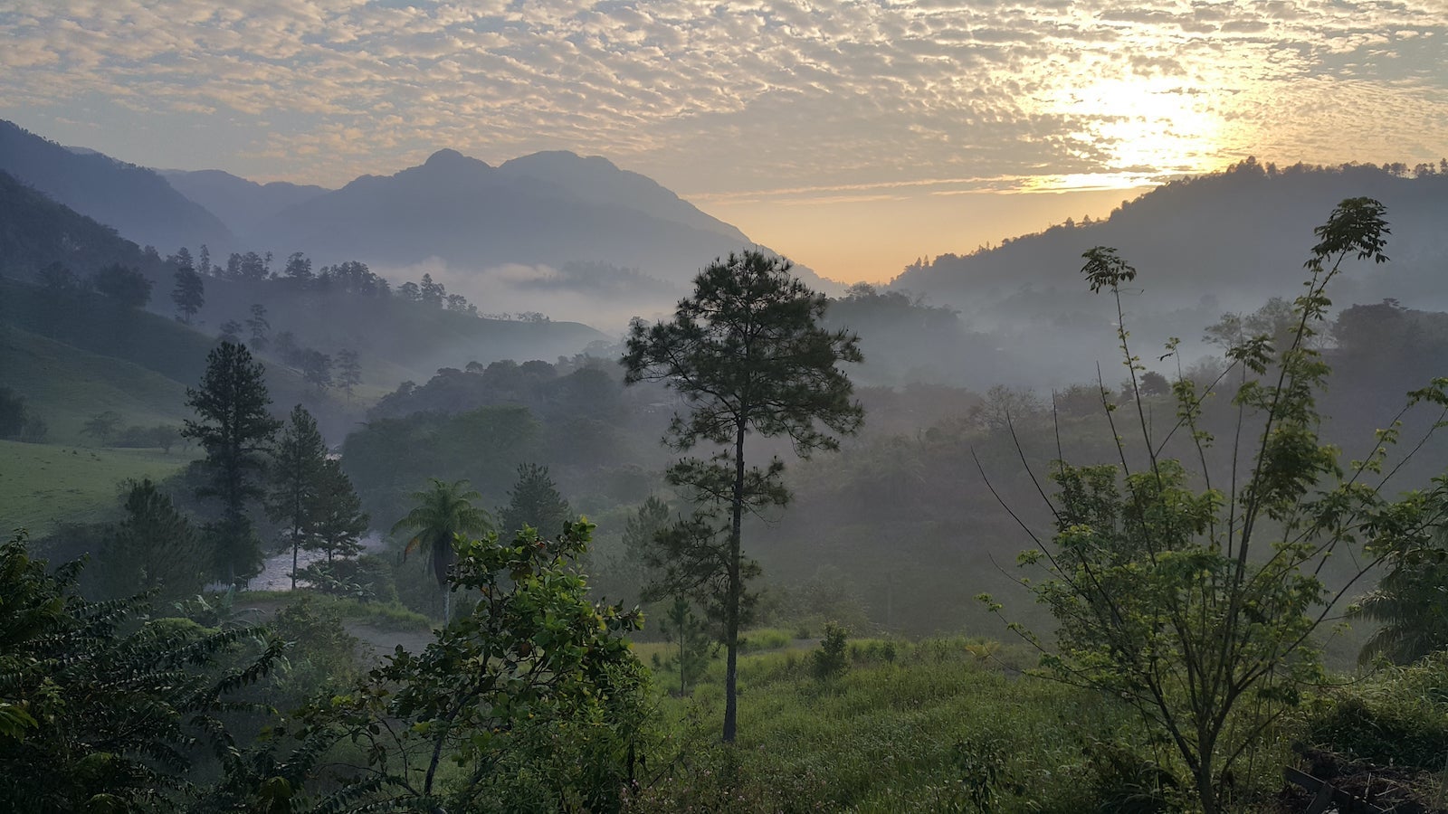 View of mountains with mist at sunrise, Lanquín