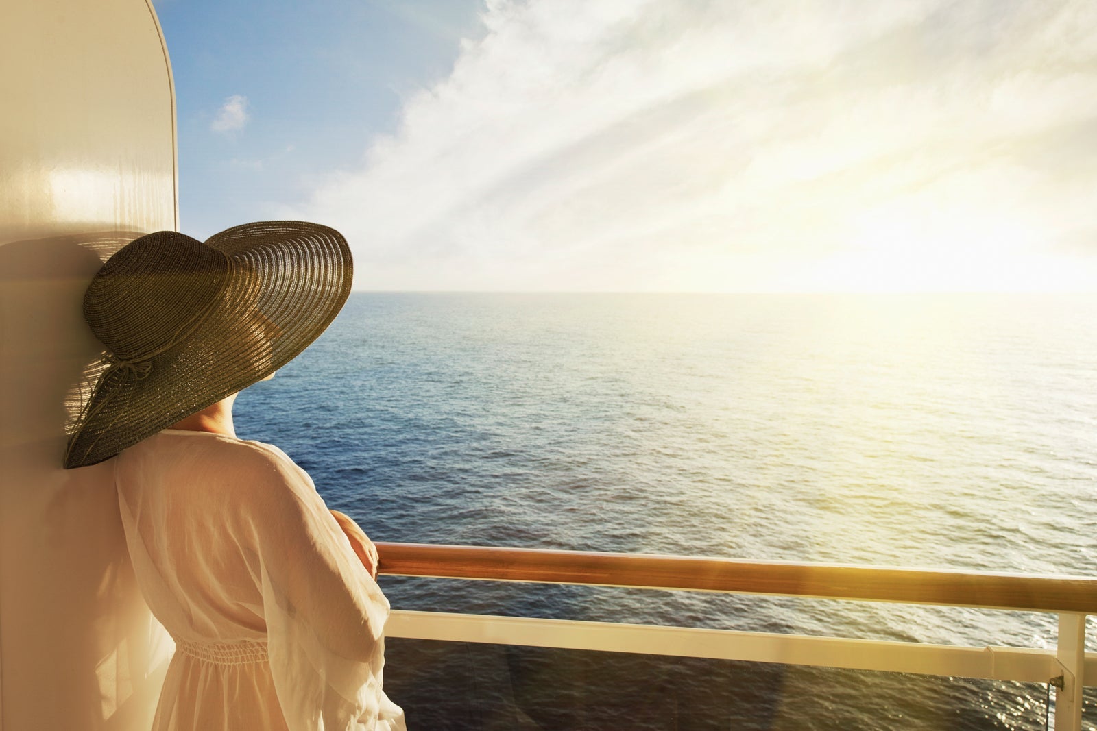 Woman looking out to sea on a cruise ship