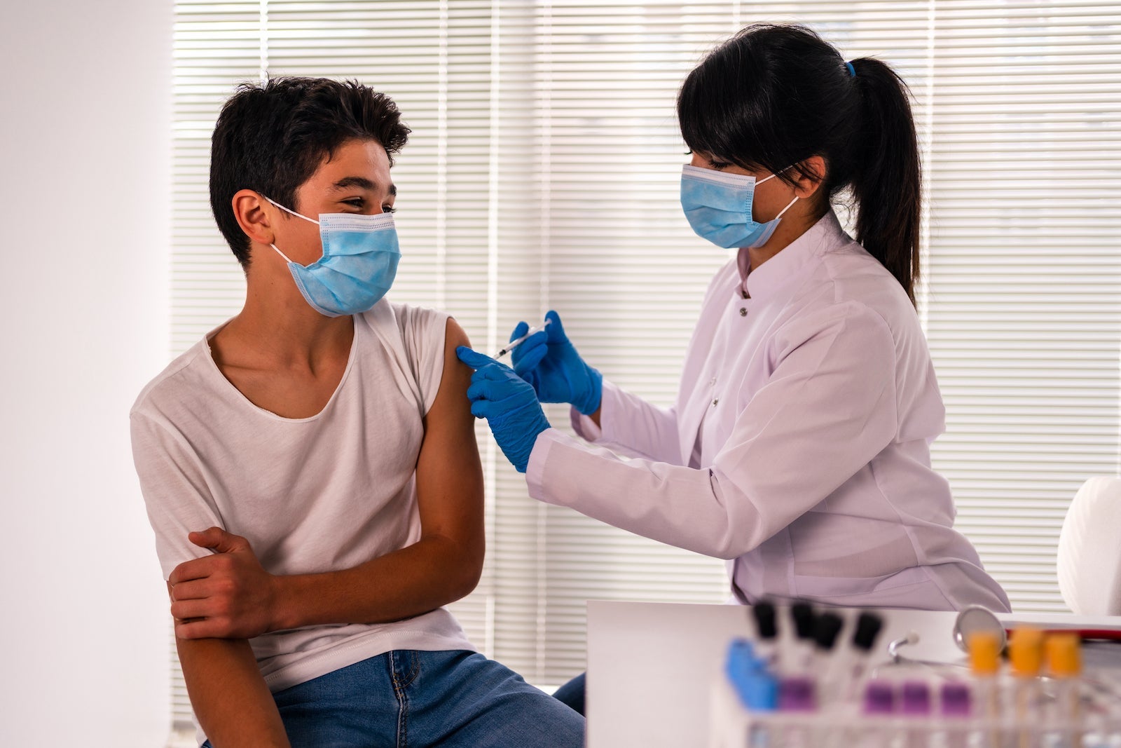 teenage boy getting vaccinated