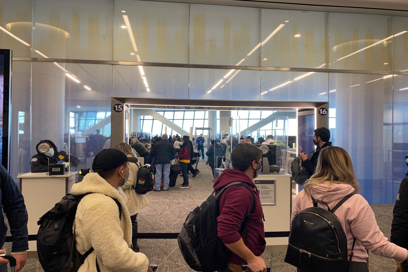 Crowds of travelers waiting for Security check, LaGuardia Airport, New York