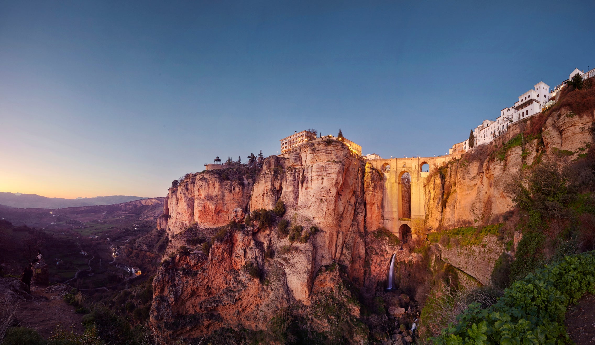 Puente Nuevo and the city of Ronda at dusk, Malaga, Spain