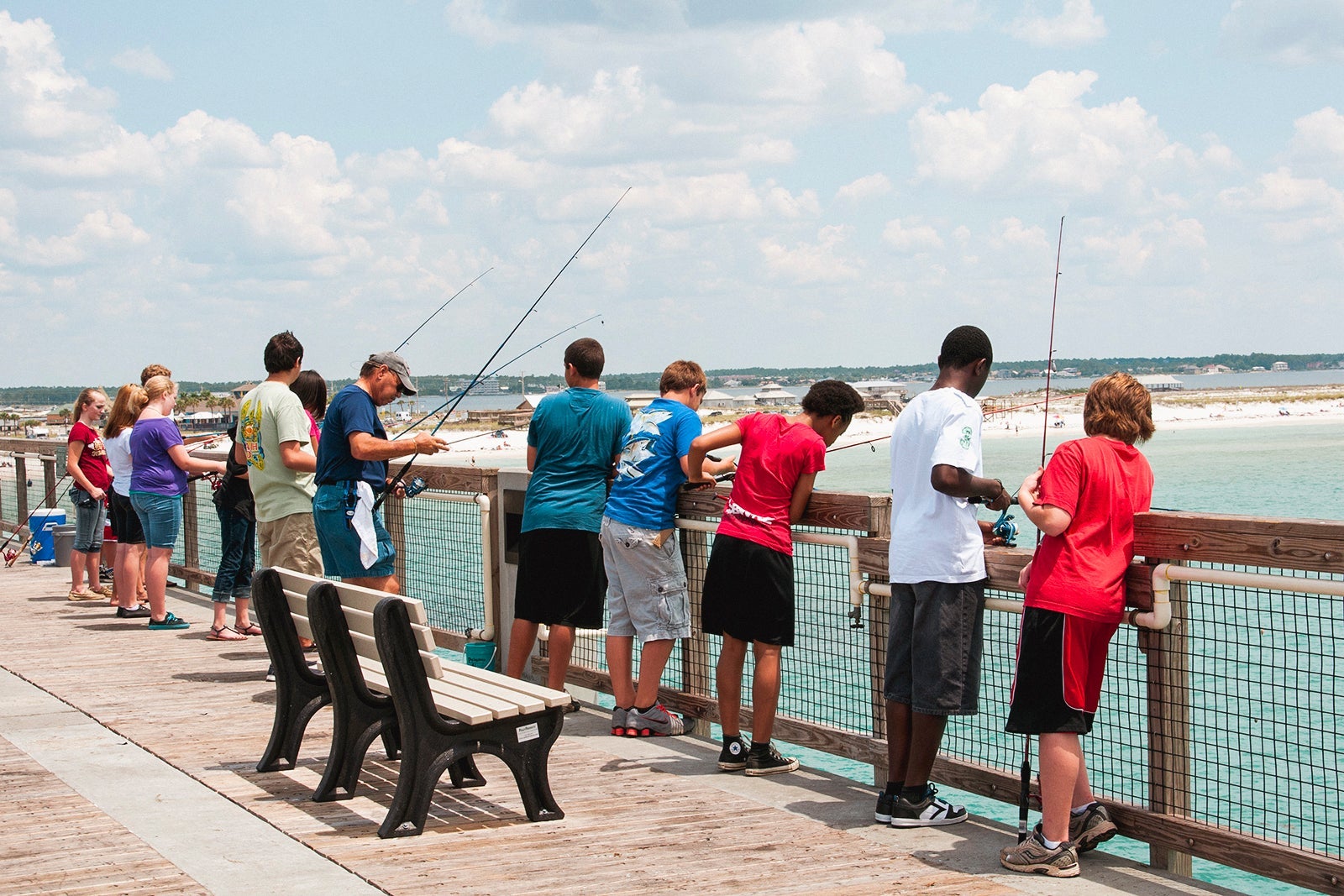 A Protect Florida's Ocean's T shirt worn by a young man fishing