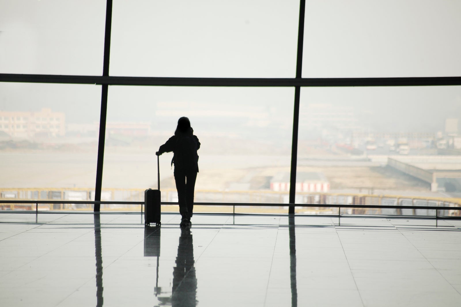Silhouette of travelers in airport