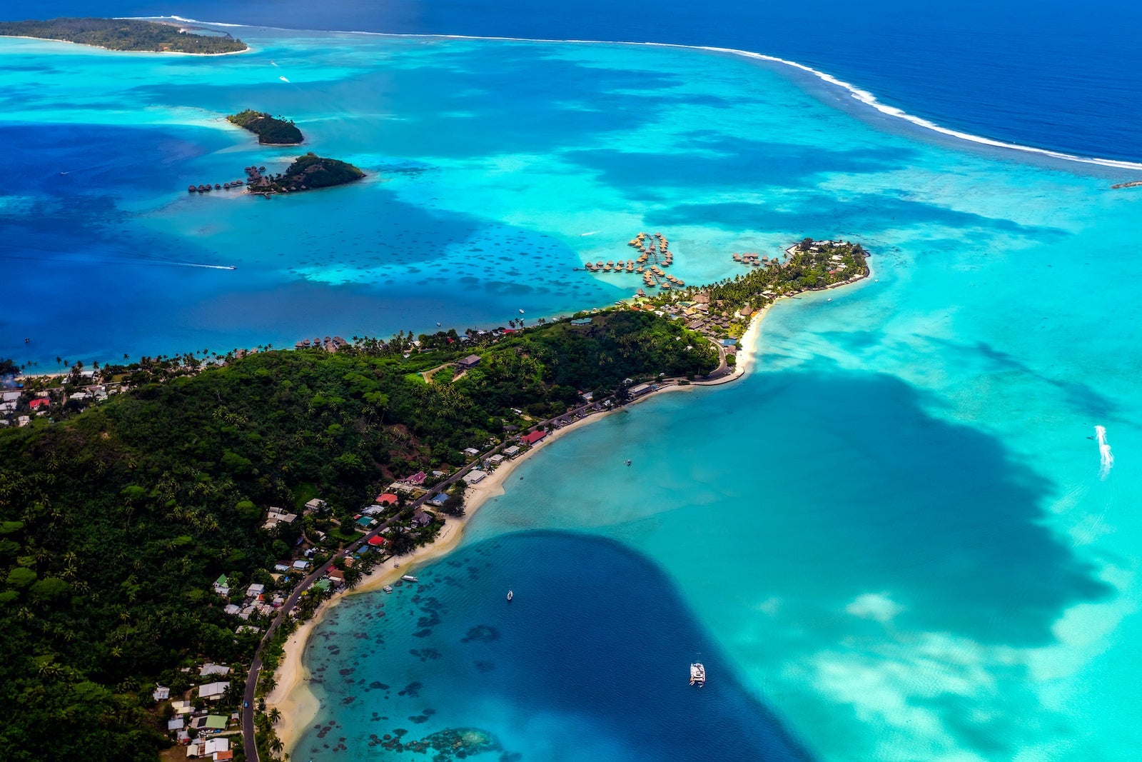 Aerial turquoise lagoon coral reef Bora Bora Island