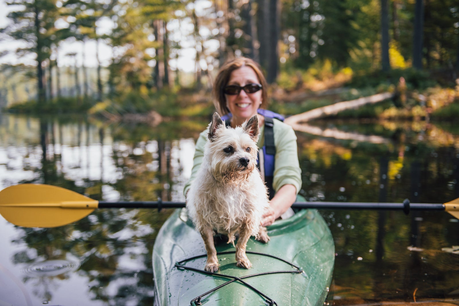 Woman Kayaking with her Dog