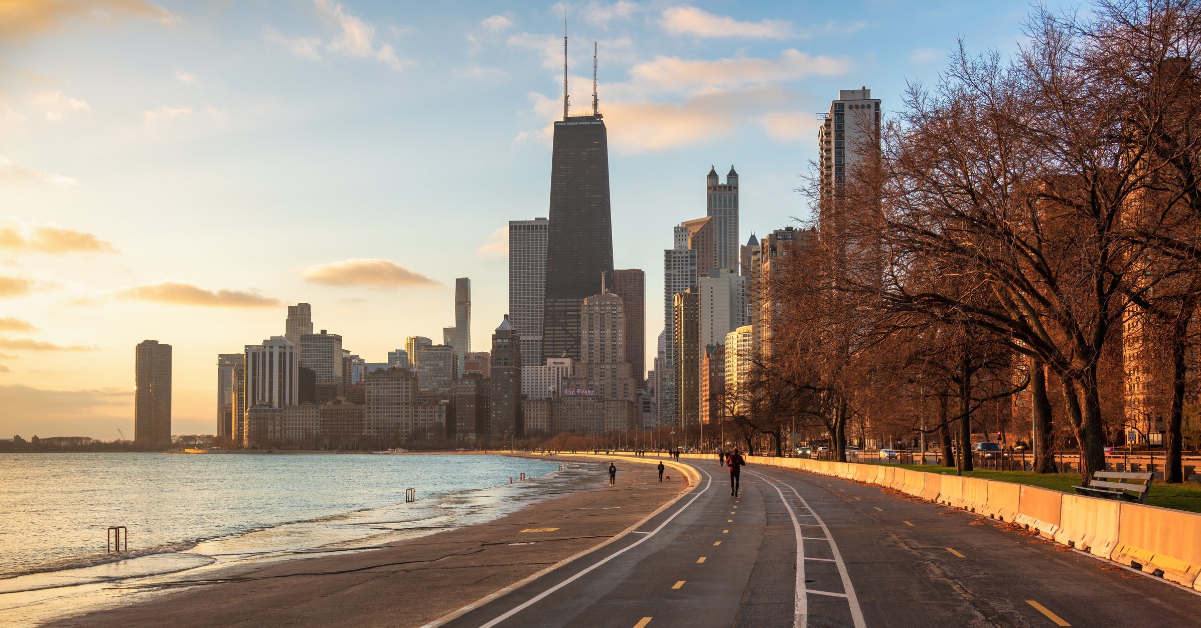 People Jogging In Front Of Skyline During Sunrise Chicago